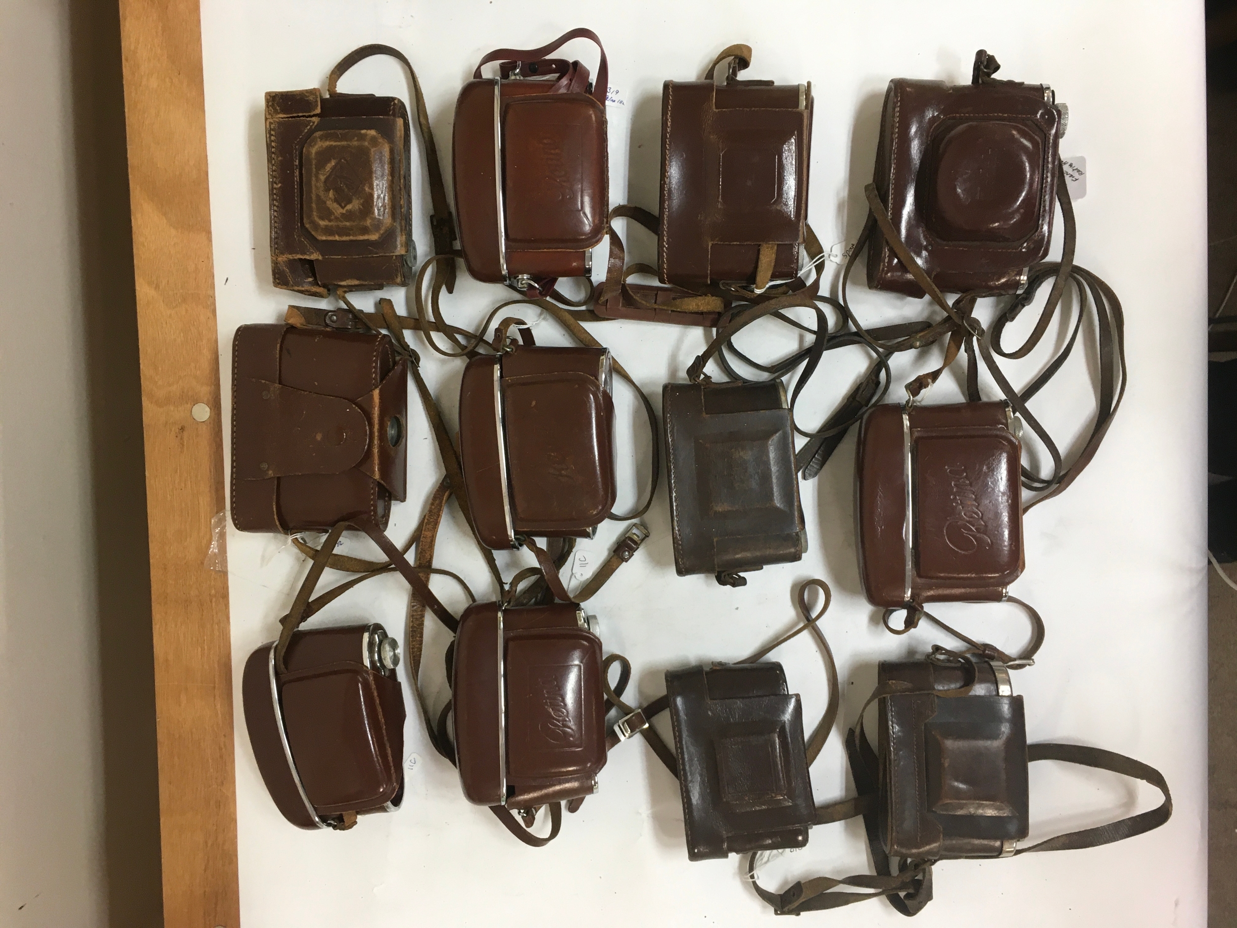 12 Empty Camera holsters/ carriers. An assortment of Kodak Retina and Zeiss Ikon and 1 Agfa holder.
