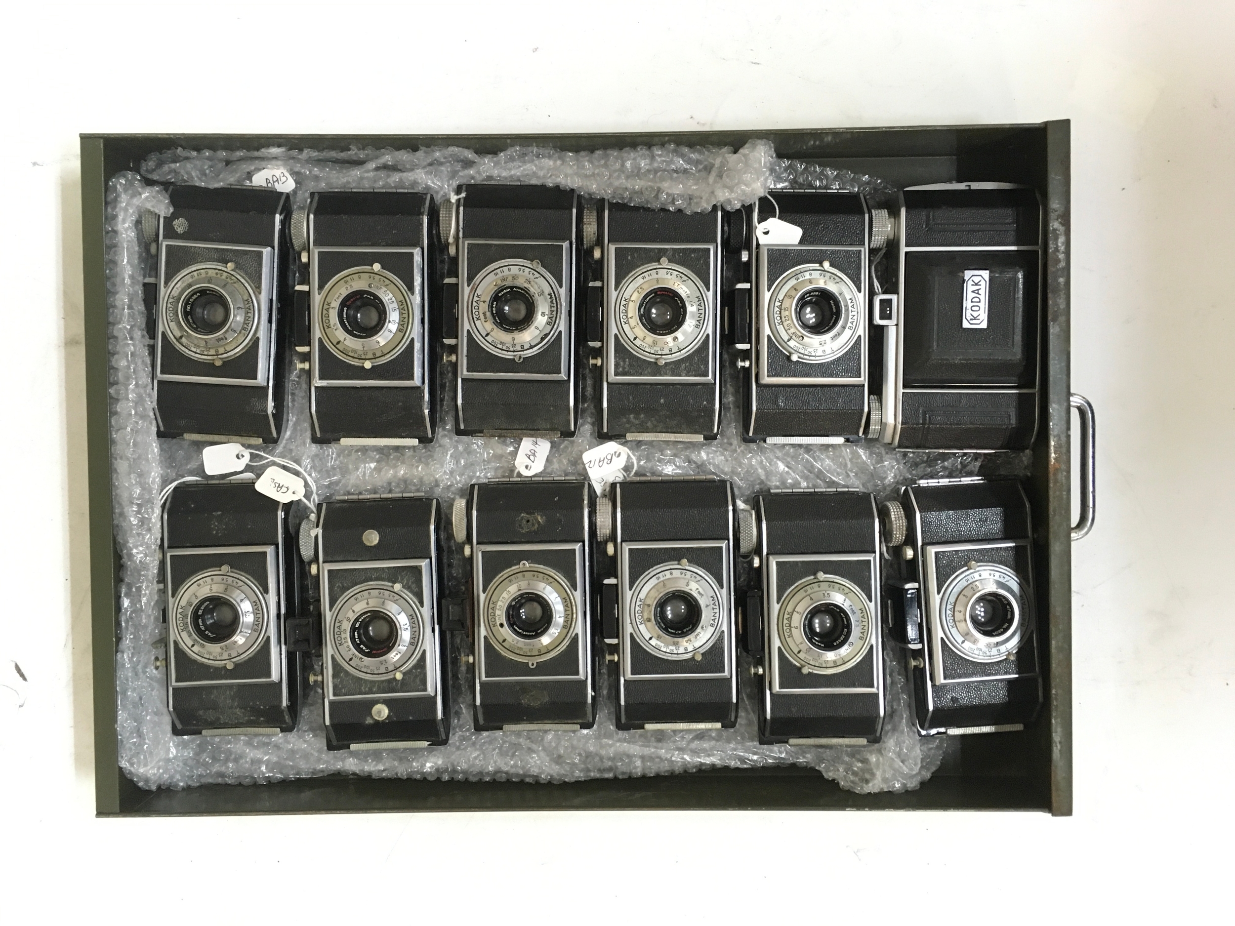 12 Cameras. 11 Kodak Bantam, 1 Kodak Retina Compur.