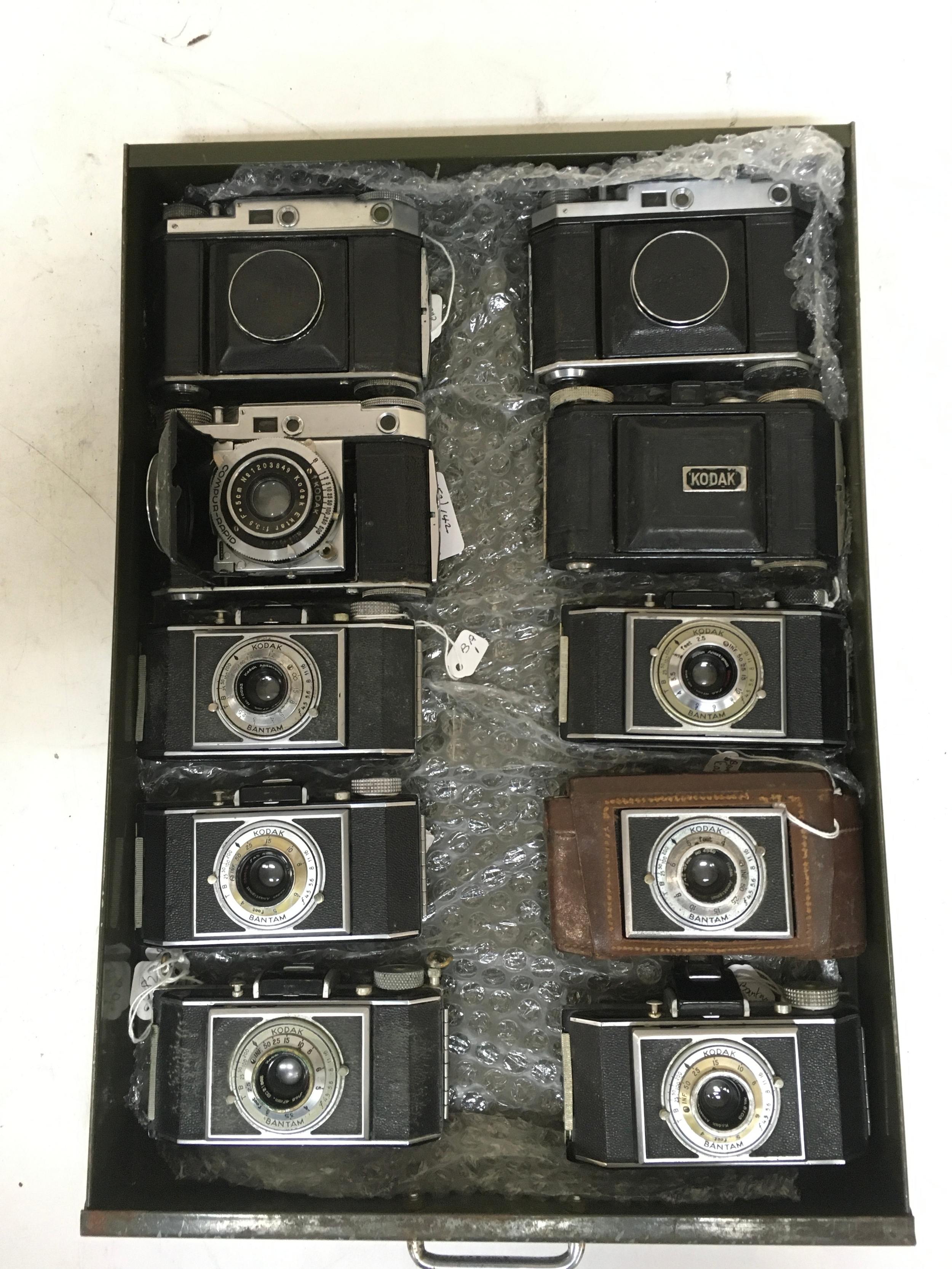 10 Cameras.  4 Kodak Compur-Rapid. 6 Kodak Bantam.