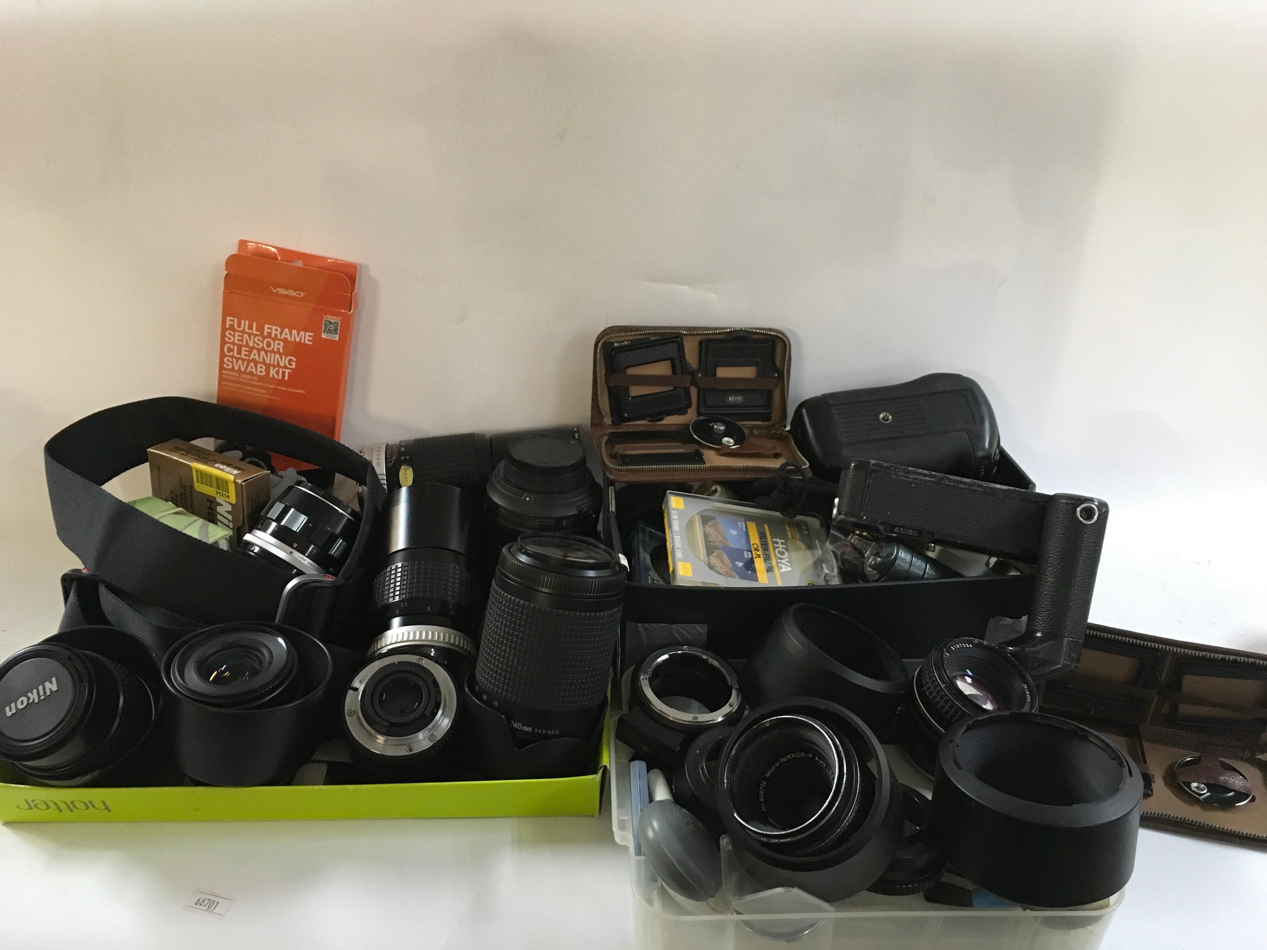 A collection of vintage camera equipment including Nikon lenses and much more 