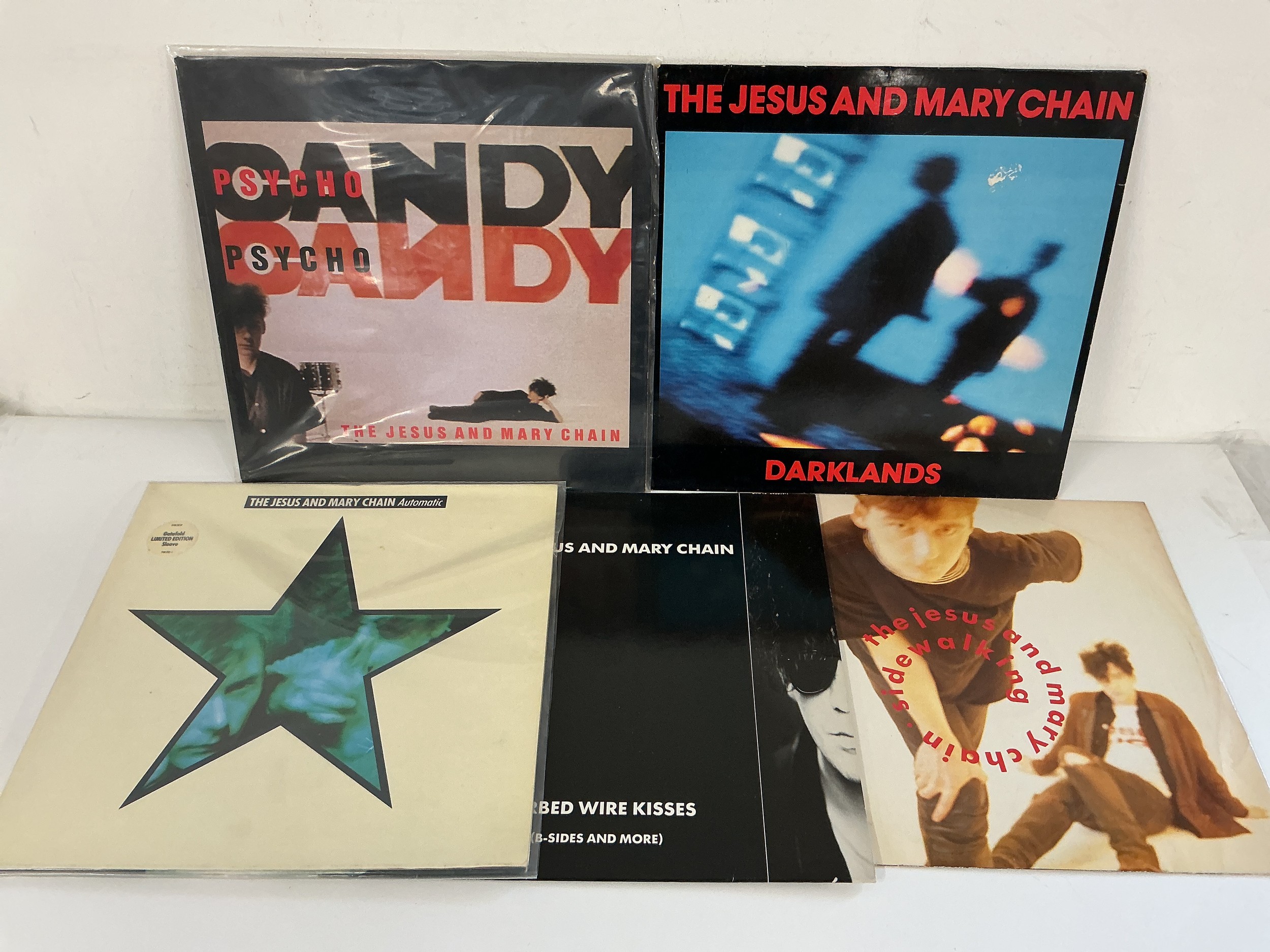 Four Jesus & Mary Chain LPs and a 12" single comprising Psycho Candy, Darklands and others.