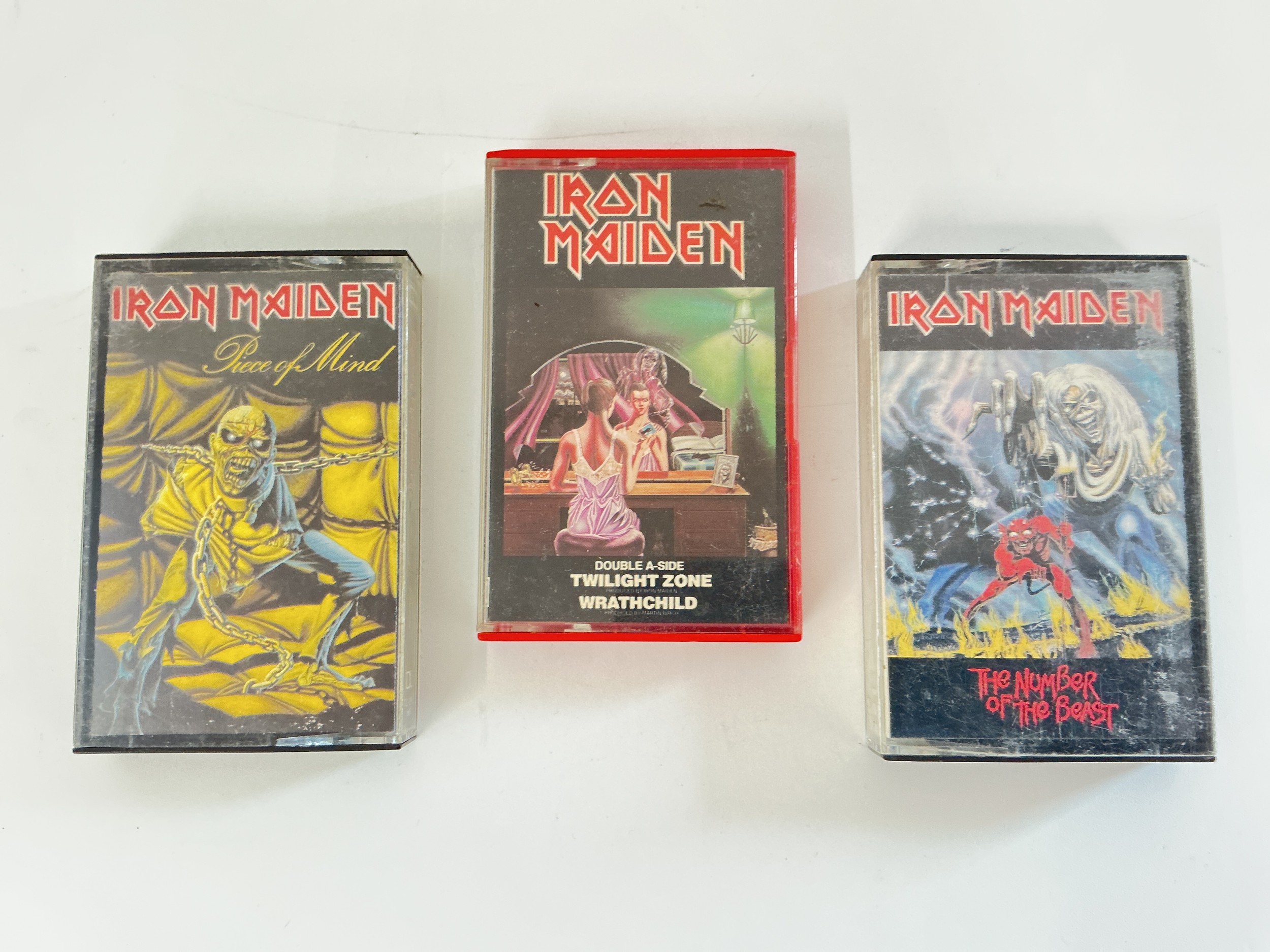 Three Iron Maiden cassettes including a rare Twilight Zone / Wrathchild double AA side release.