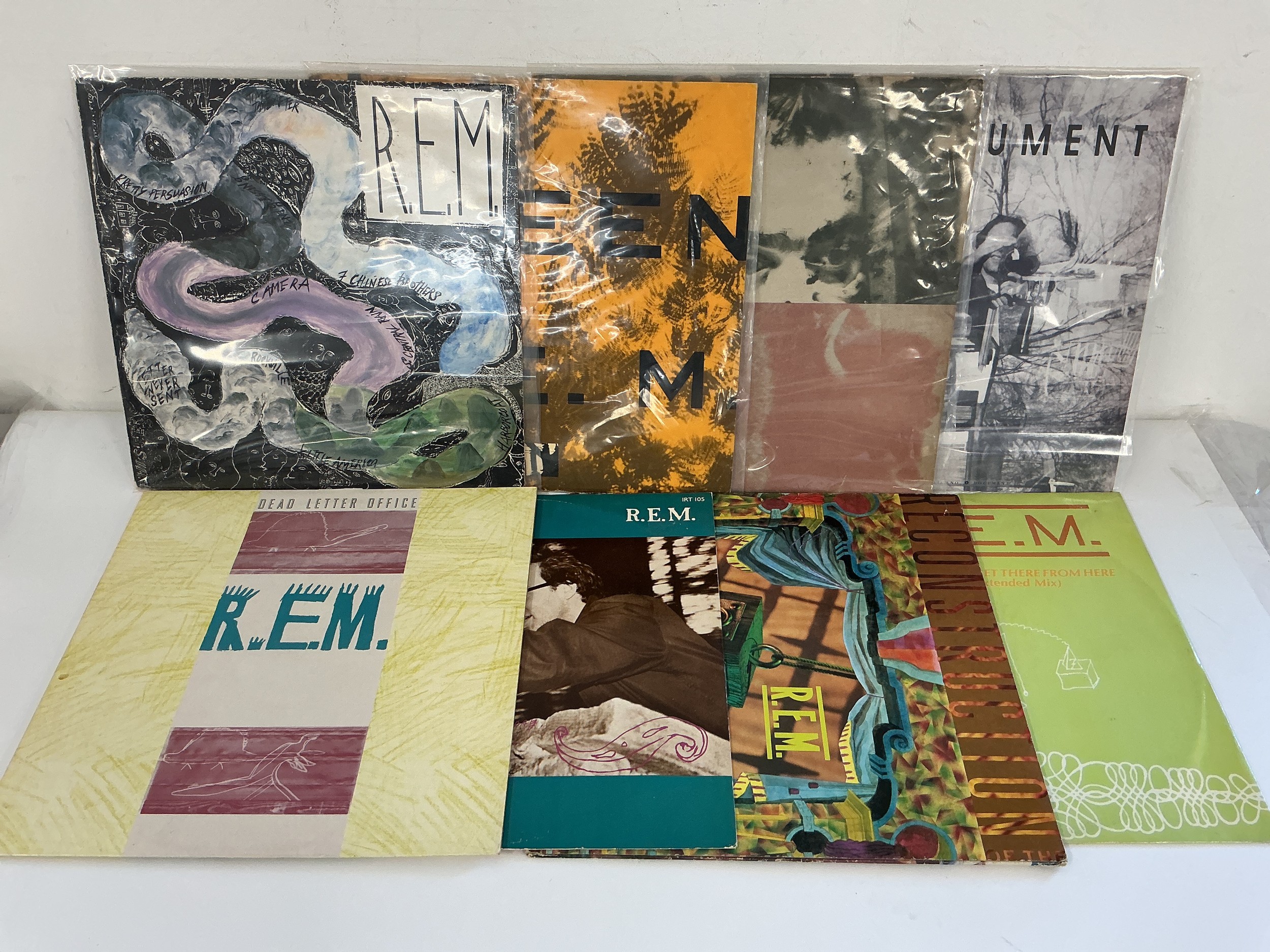 Six early UK pressings of REM LPs and two 12" singles comprising Green, Life's Rich Pageant, Reckoning and others.