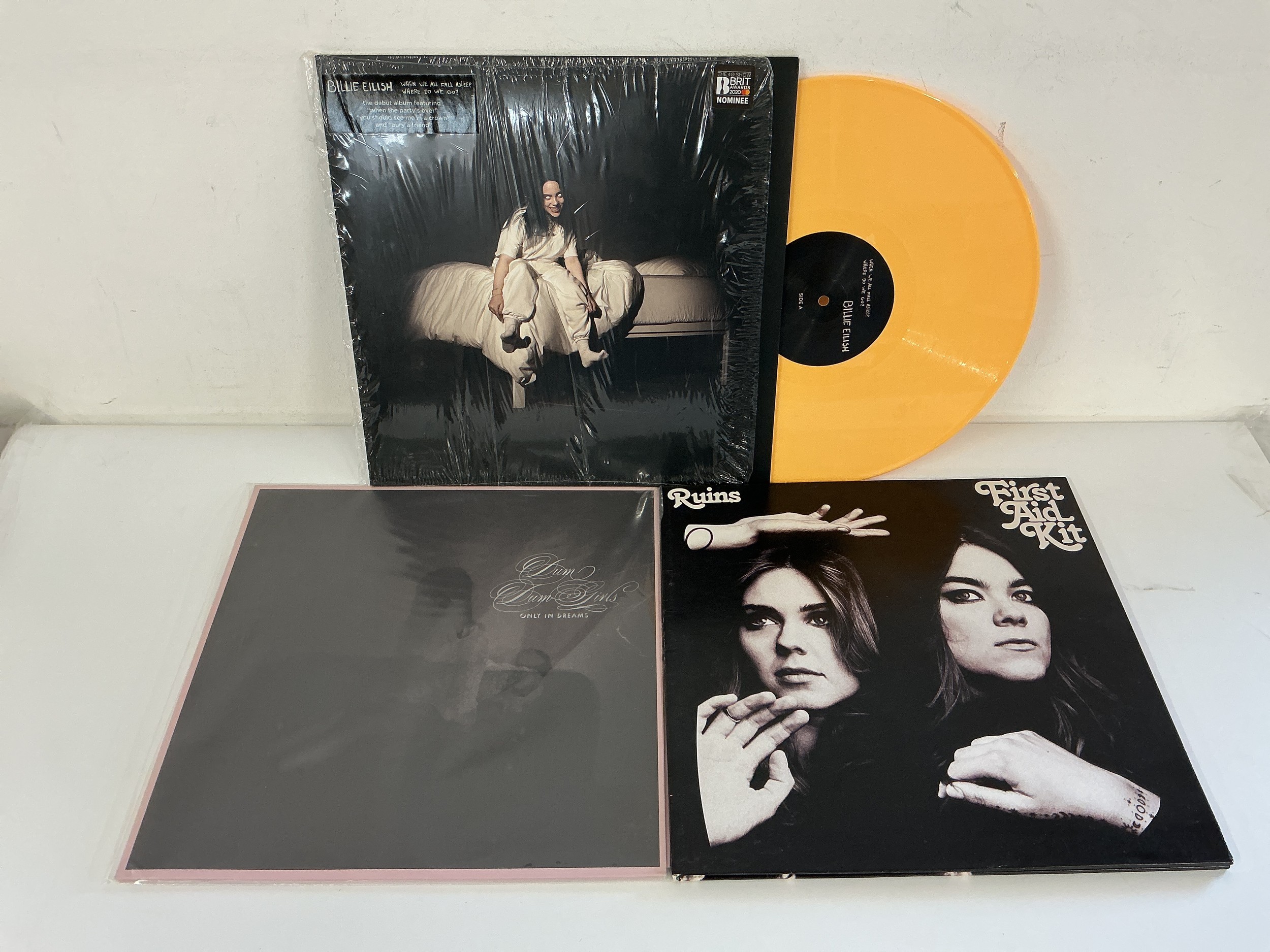 Three indie pop LPs by Billie Eilish, First Aid Kit and Dum Dum Girls.