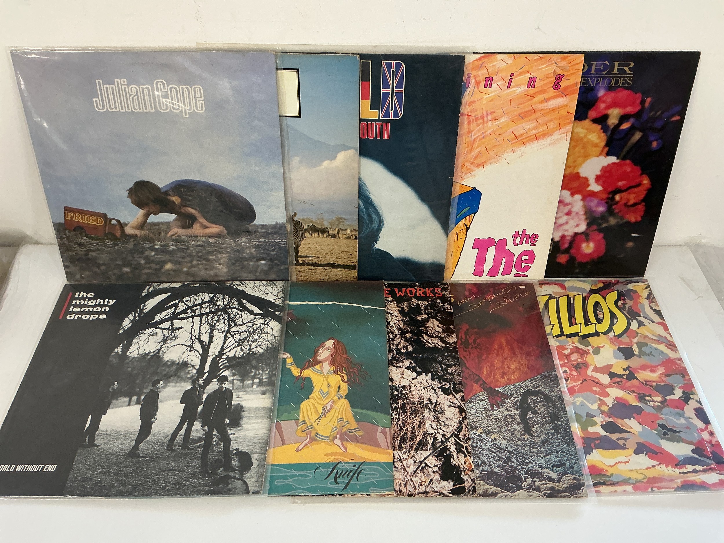 Two bags containing 21 rock and pop LPs and 12" singles by various artists including The Teardrop Explodes, Icicle Works, The The and others.