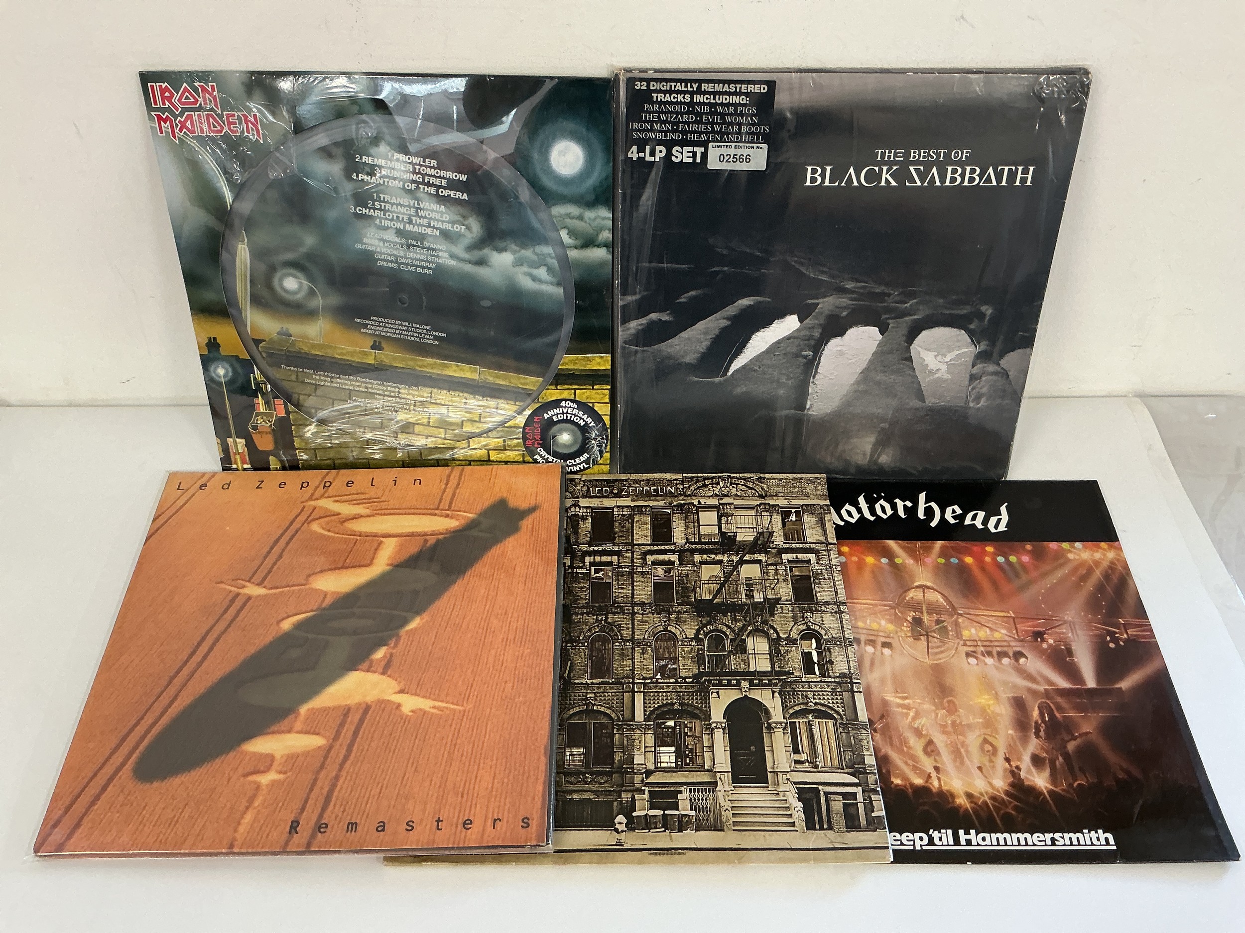 Five heavy rock LPs comprising a 4LP Best Of Black Sabbath, a 40th anniversary clear vinyl and picture disc Iron Maiden LP, Led Zeppelin Remasters, a 40th anniversary Physical Graffiti and Motörhead - No Sleep 'til Hammersmith.