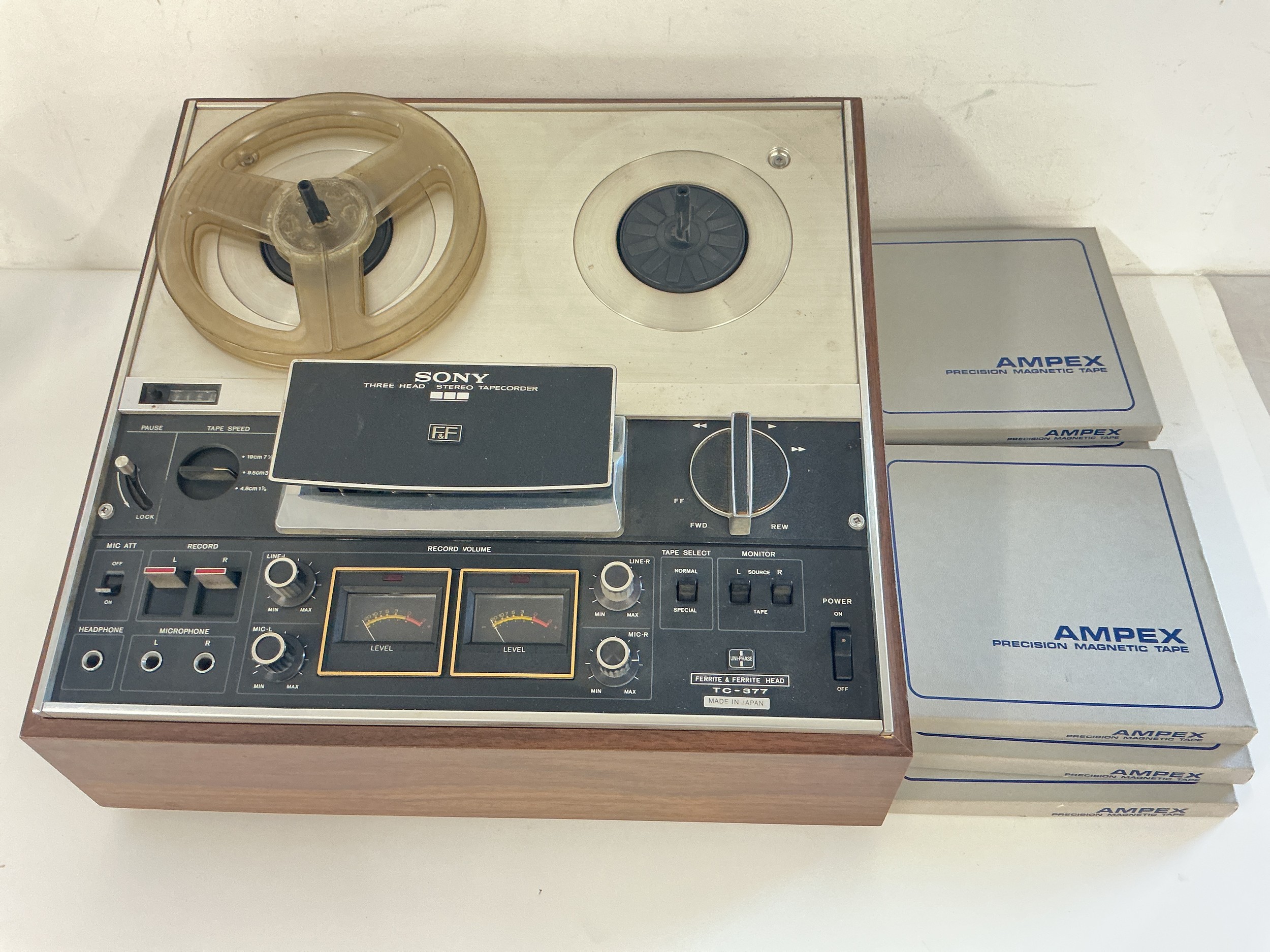 A Sony TC-377 reel to reel tapecorder and some reels together with a Sony TC161 SD tapecorder with manual and sealed blank audio cassettes.