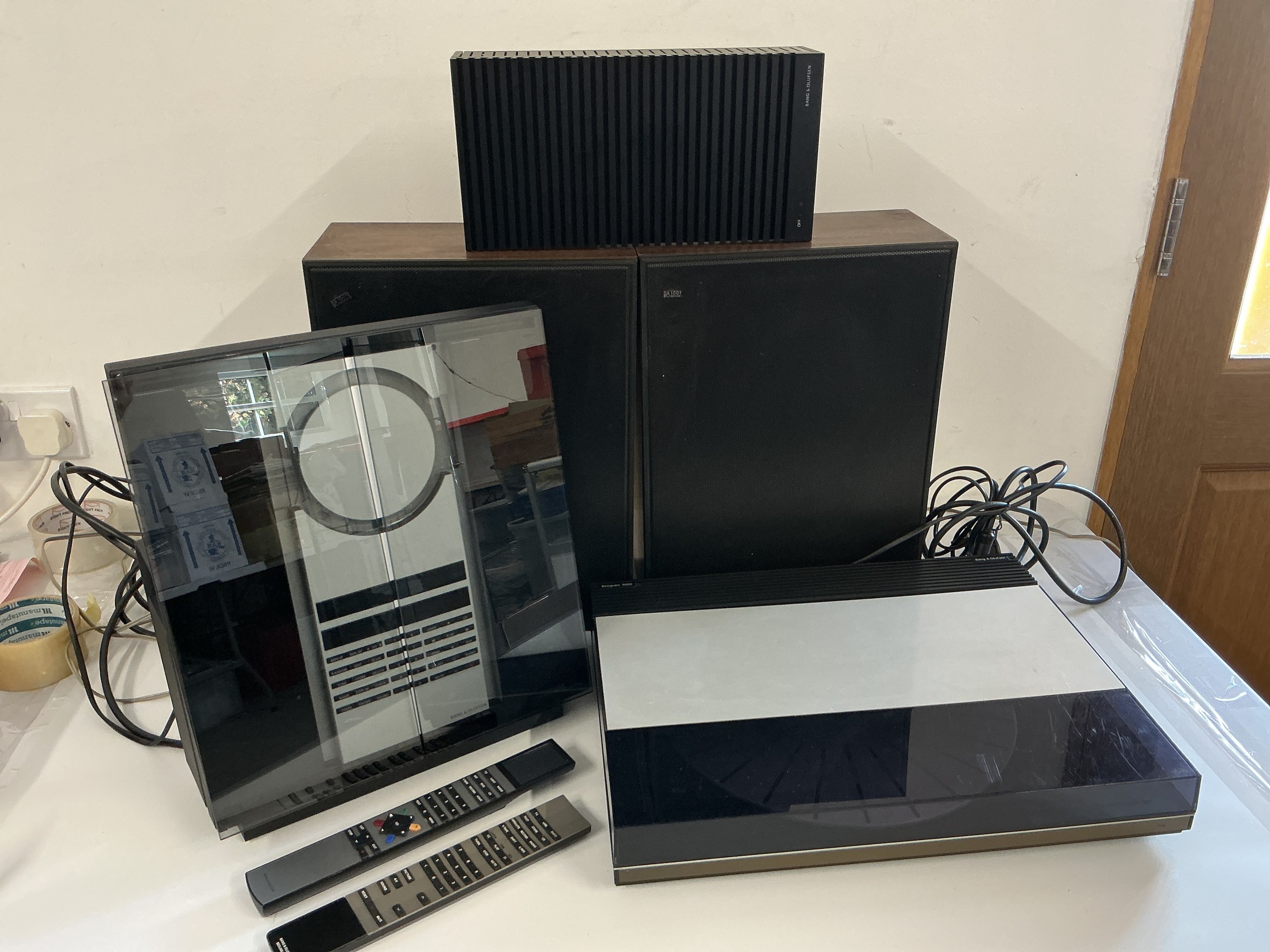 A Bang & Olufsen hifi system comprising a Beogram 9000, Beosound 3000, a pair of Beovox 1001 speakers plus a further pair of B&O speakers, remote controls, manuals, cables etc.