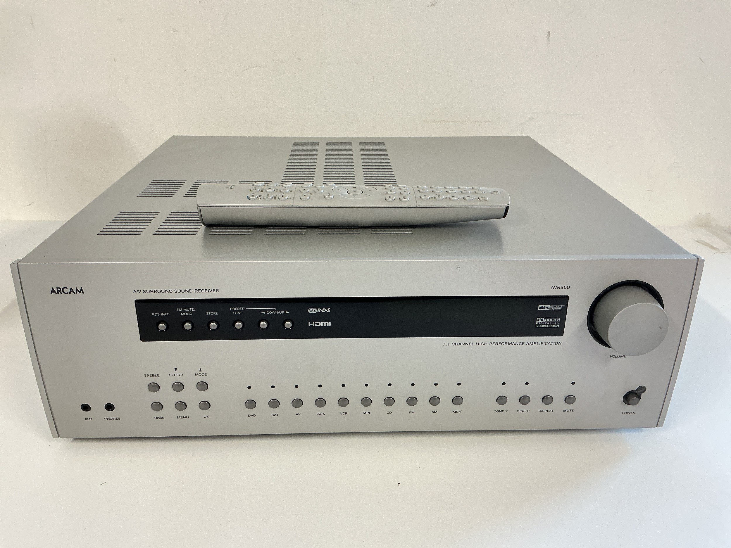An Arcam AVR350 receiver with remote control.