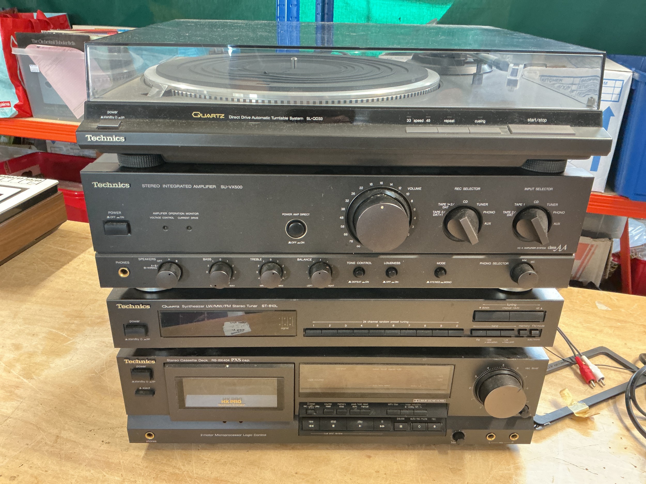 A Technics stacking hifi system comprising an SL-QD33 turntable, SU-Vx500 amp, ST-610L tuner and an RS-BX404 cassette deck.