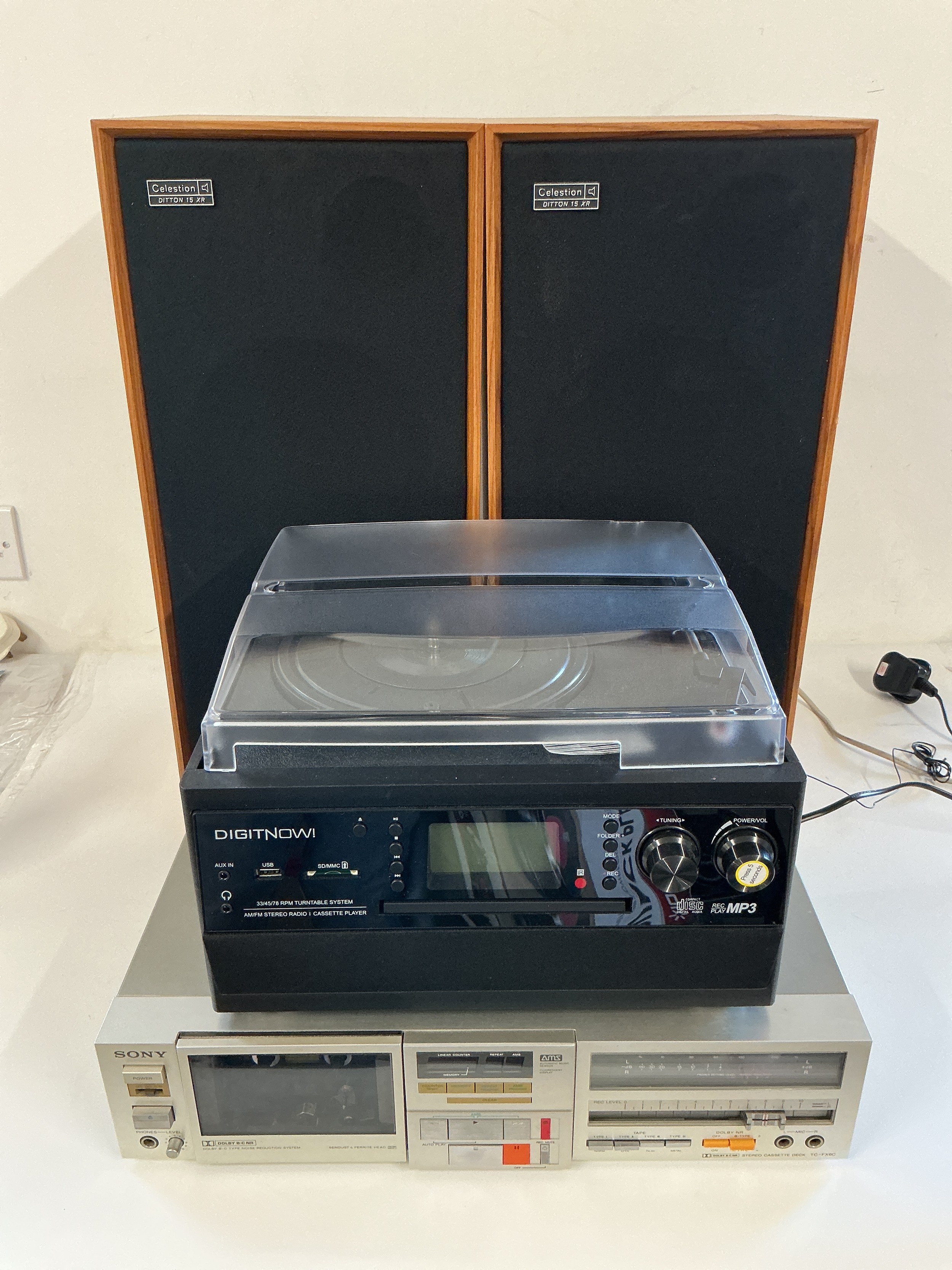 A collection of boxed audio visual equipment comprising a pair of Celestion Ditton 15XR speakers, a Sony TC-FX6C cassette deck, an ion LP to MP3 turntable, a Digit Now music system and a vintage Hitachi Intavision portable TV and cassette deck system. Manuals and leads supplied.