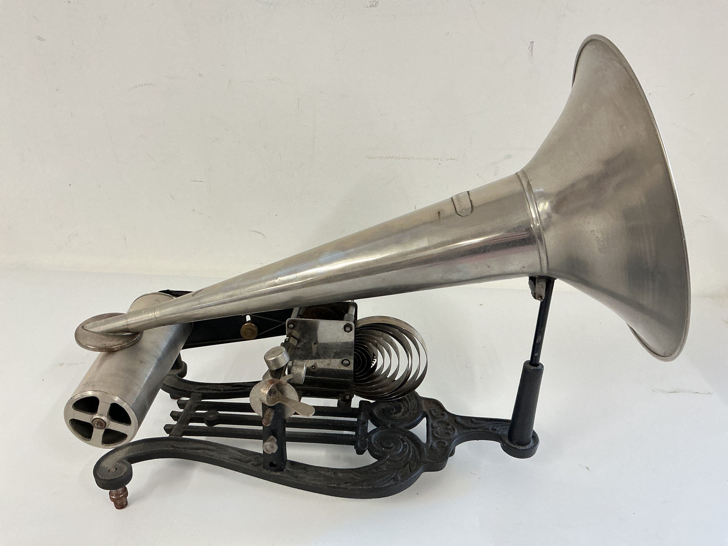 A late 19th Century Edison Puck cylinder phonograph with a collection of Edison rolls.