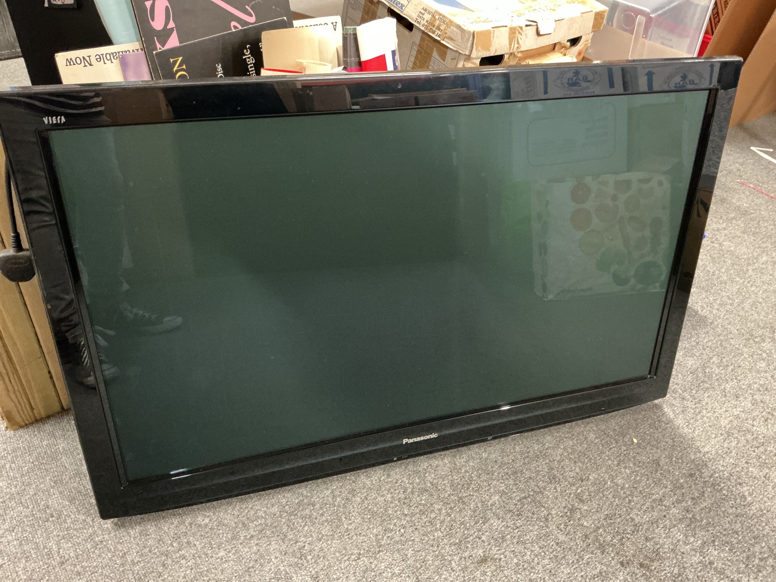 Two Panasonic TVs comprising a 55" TX-55GZ950B with remote control and manual plus a 42" TX-42G20B with remote control etc