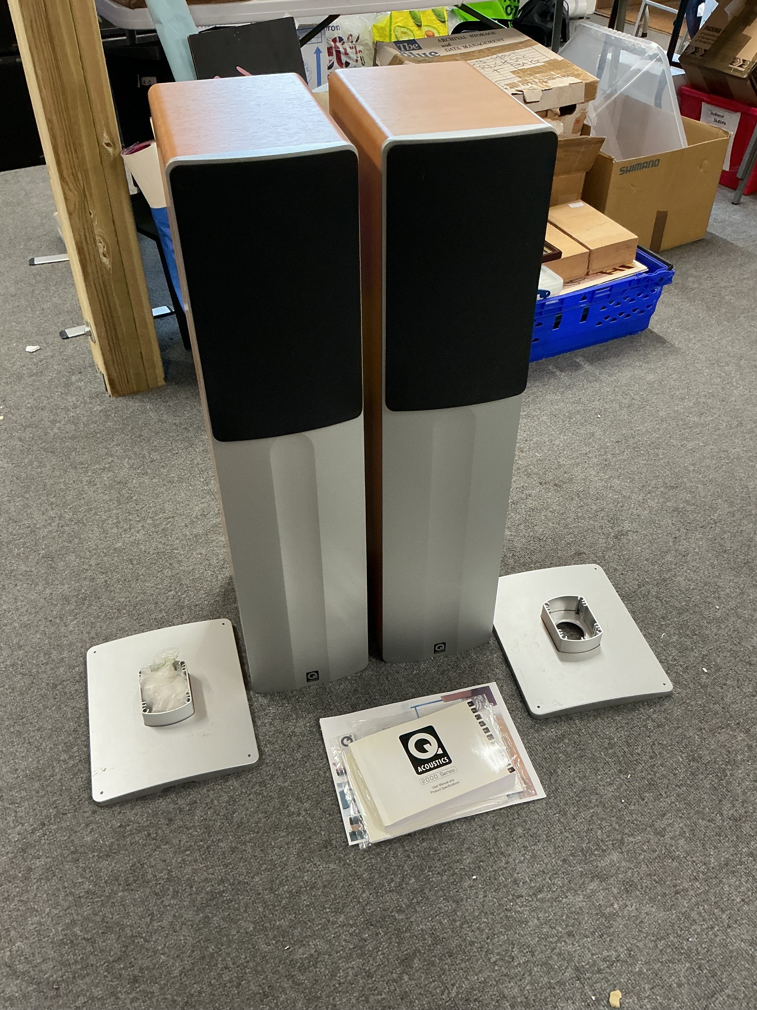 A boxed set of Q Acoustics surround sound speakers. Comes with manuals.