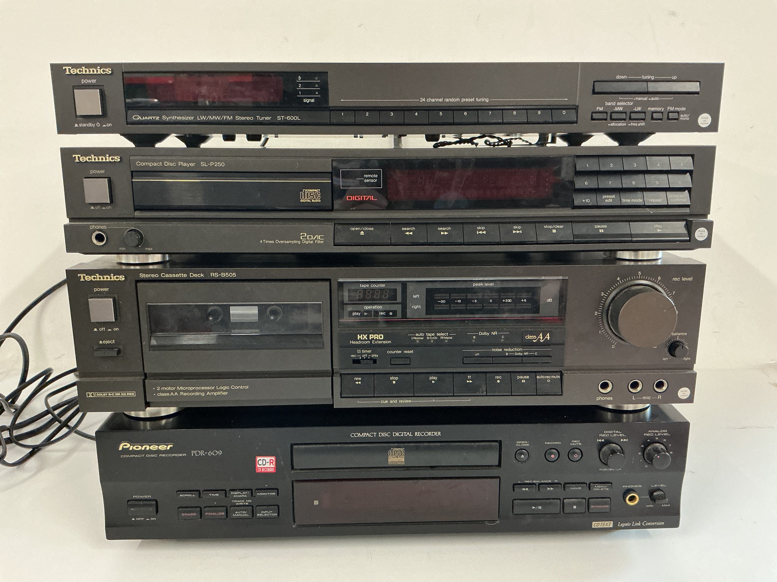 A boxed Pioneer PDR-609 CD recorder and three Technics hifi separates. Comes with manuals and two remote controls.