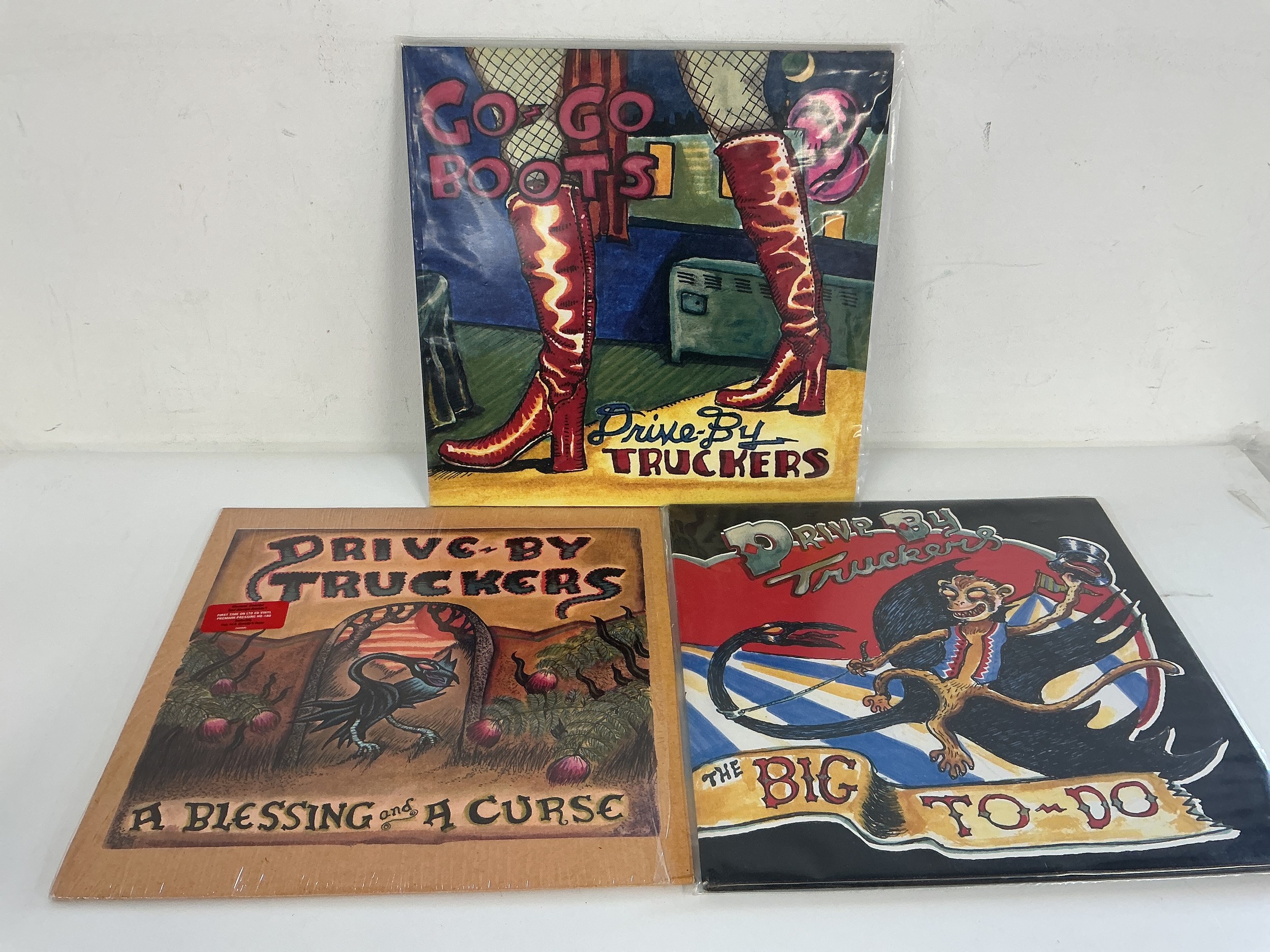 Three LPs by Drive By Truckers comprising Go Go Boots, A Blessing & A Curse and The Big To Do.