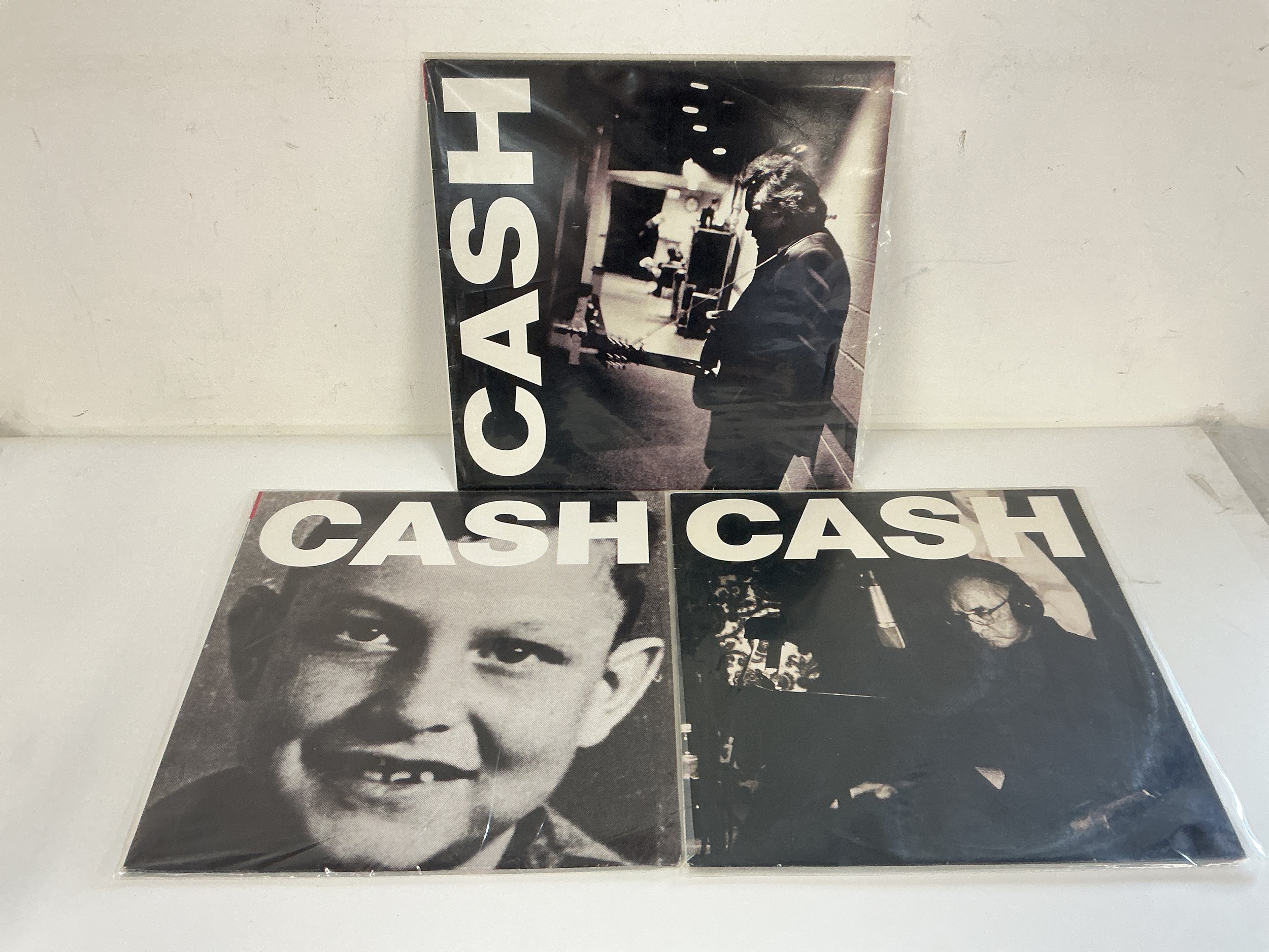 Three Johnny Cash LPs comprising Solitary Man, Ain't No Grave and A Hundred Highways.