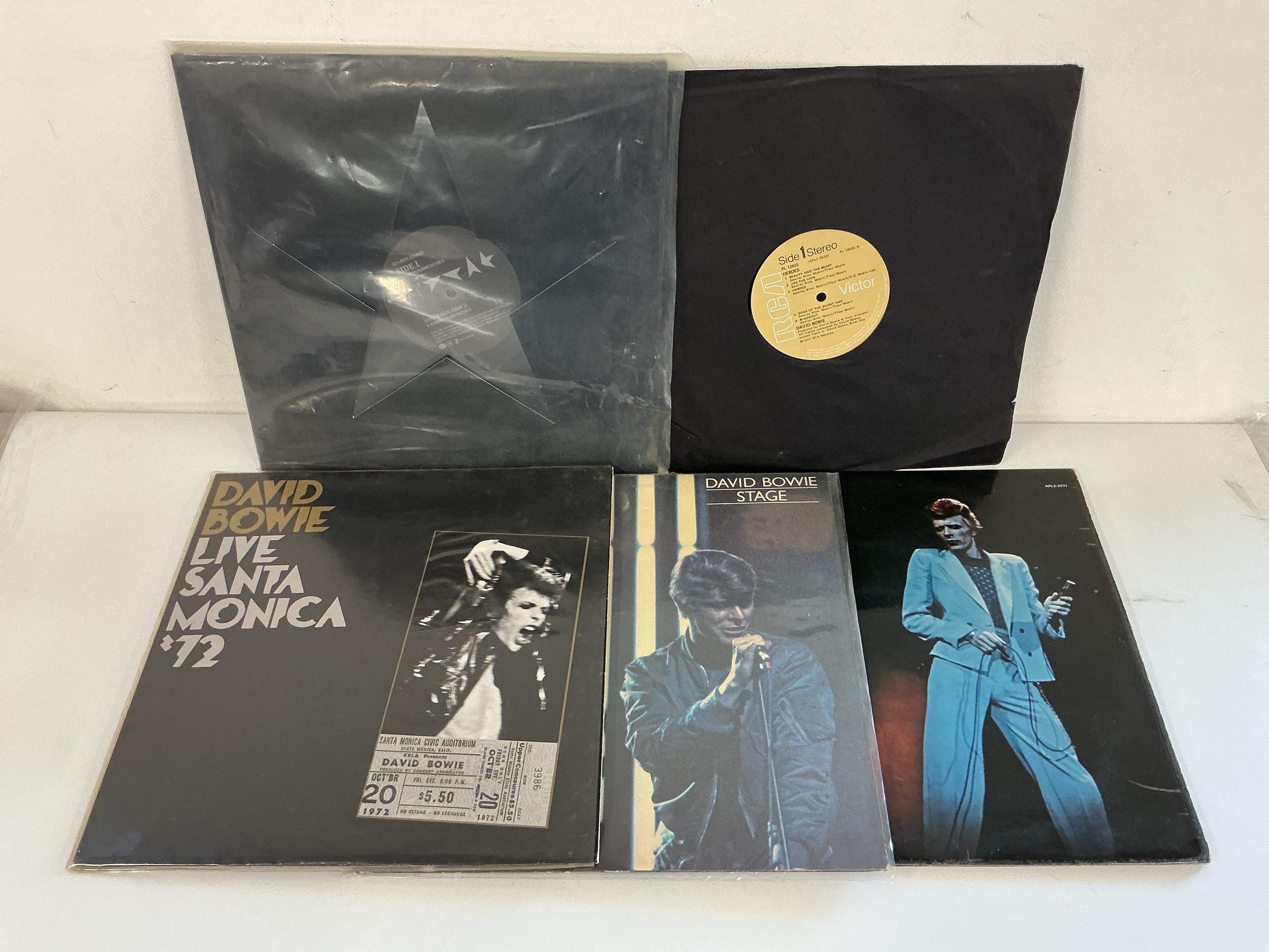 Five David Bowie LPs comprising Blackstar, Heroes (missing cover), Live Santa Monica '72 and others.