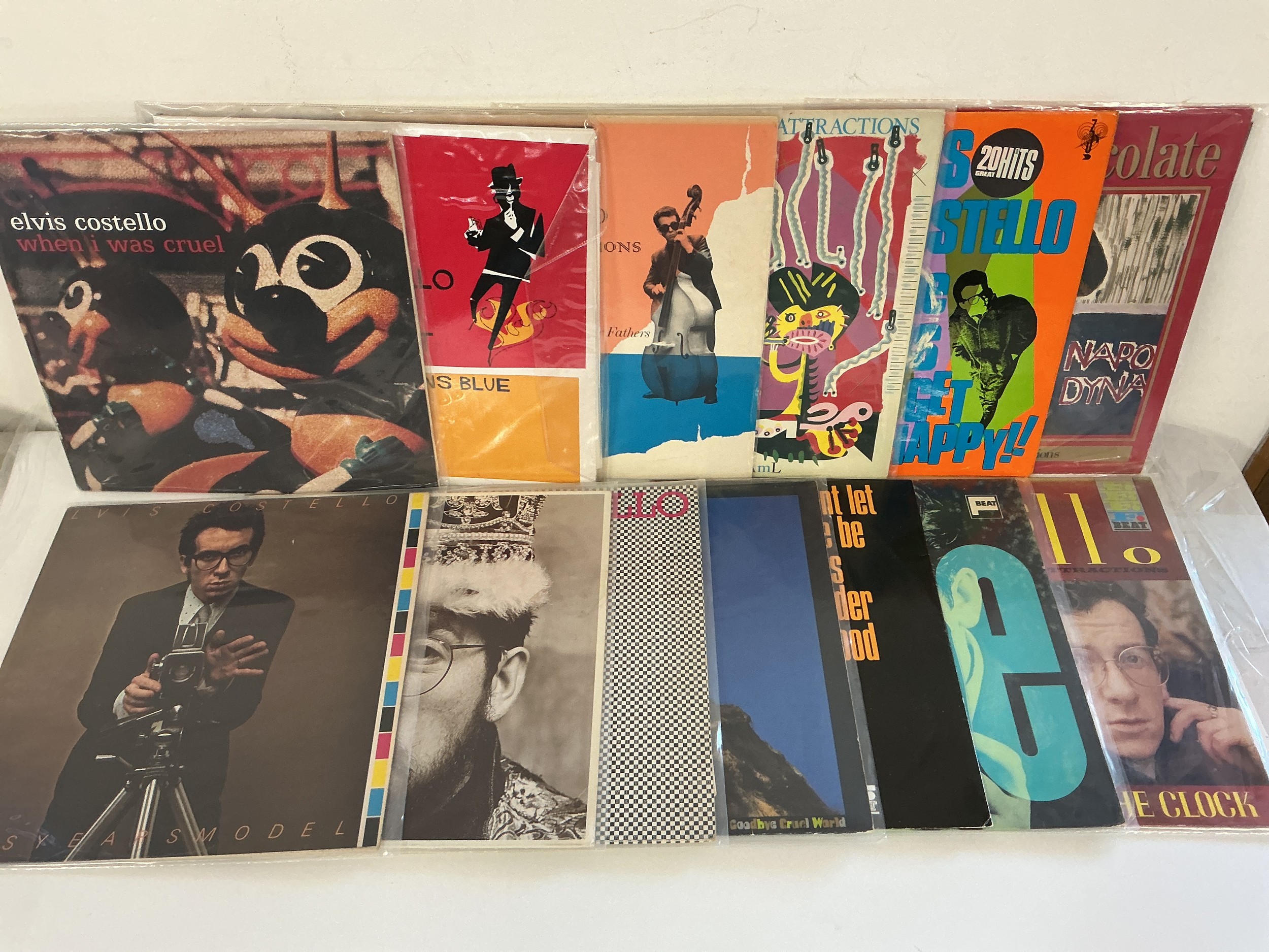 Thirteen Elvis Costello LPs comprising My Flame Burns Blue, Get Happy, When I Was Cruel and others.