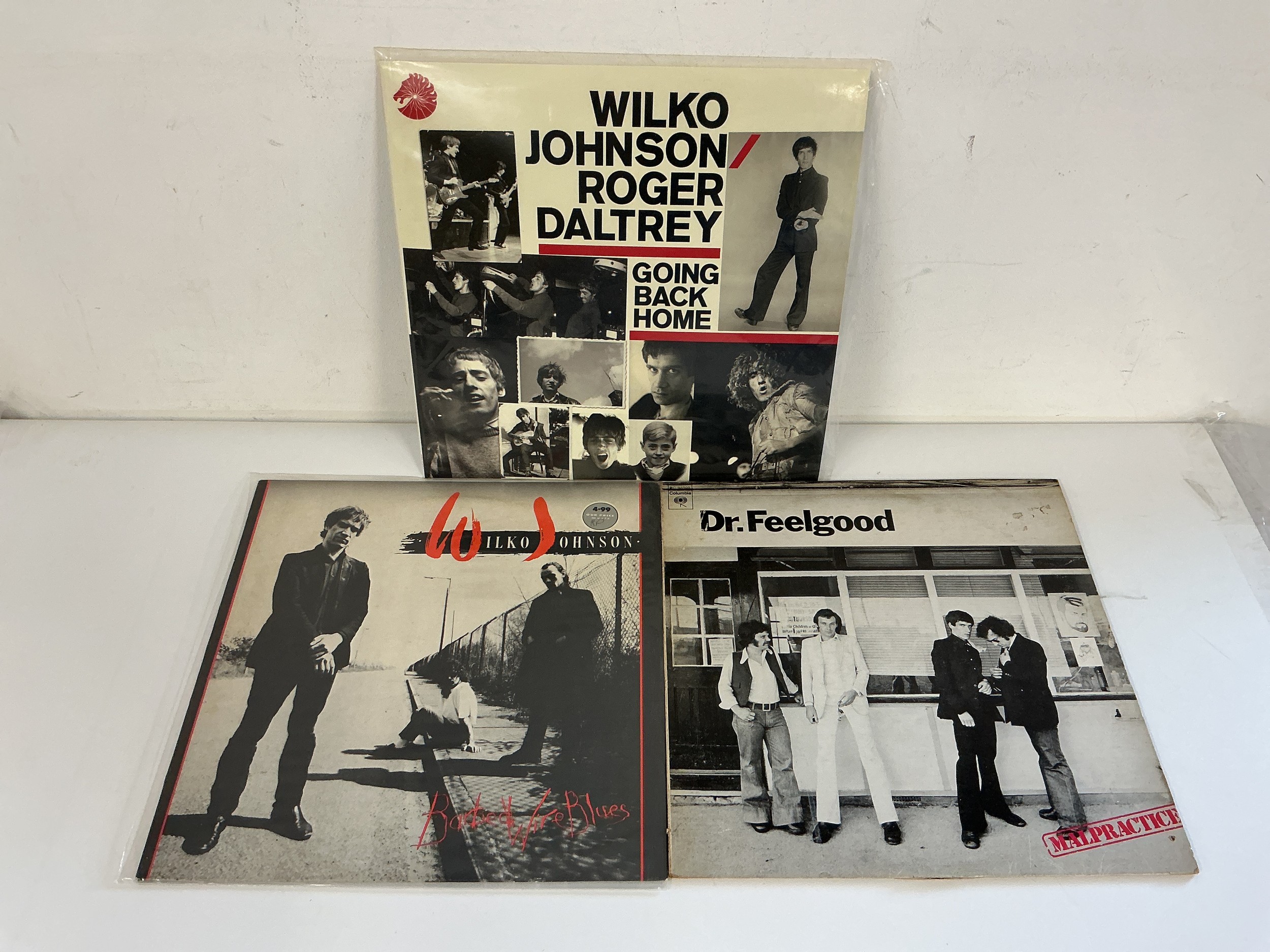 Three Wilko Johnson and related LPs.