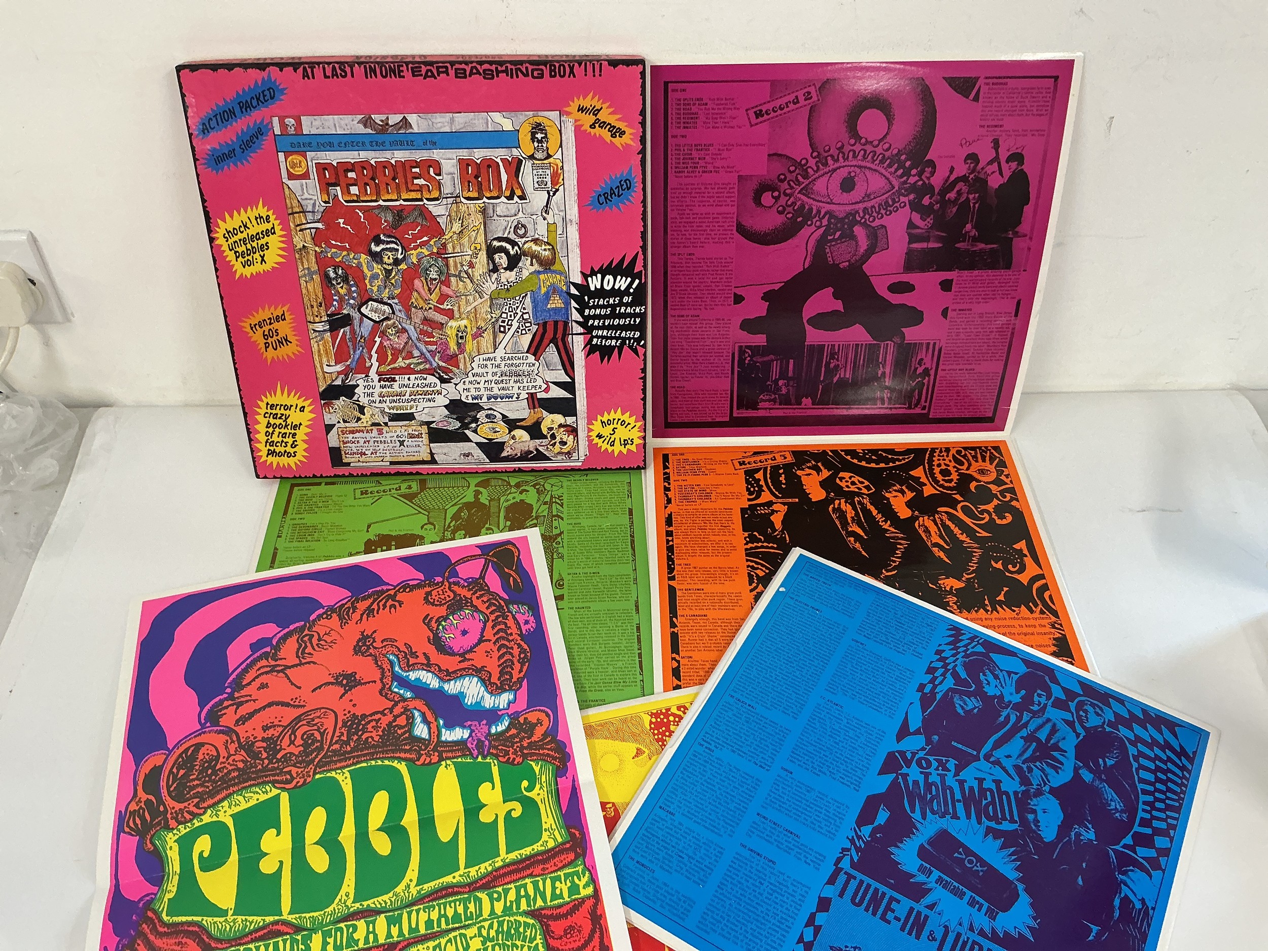 A Pebbles 5LP vinyl box set complete with poster and a Psychedelic Years 4LP box set with poster (2).