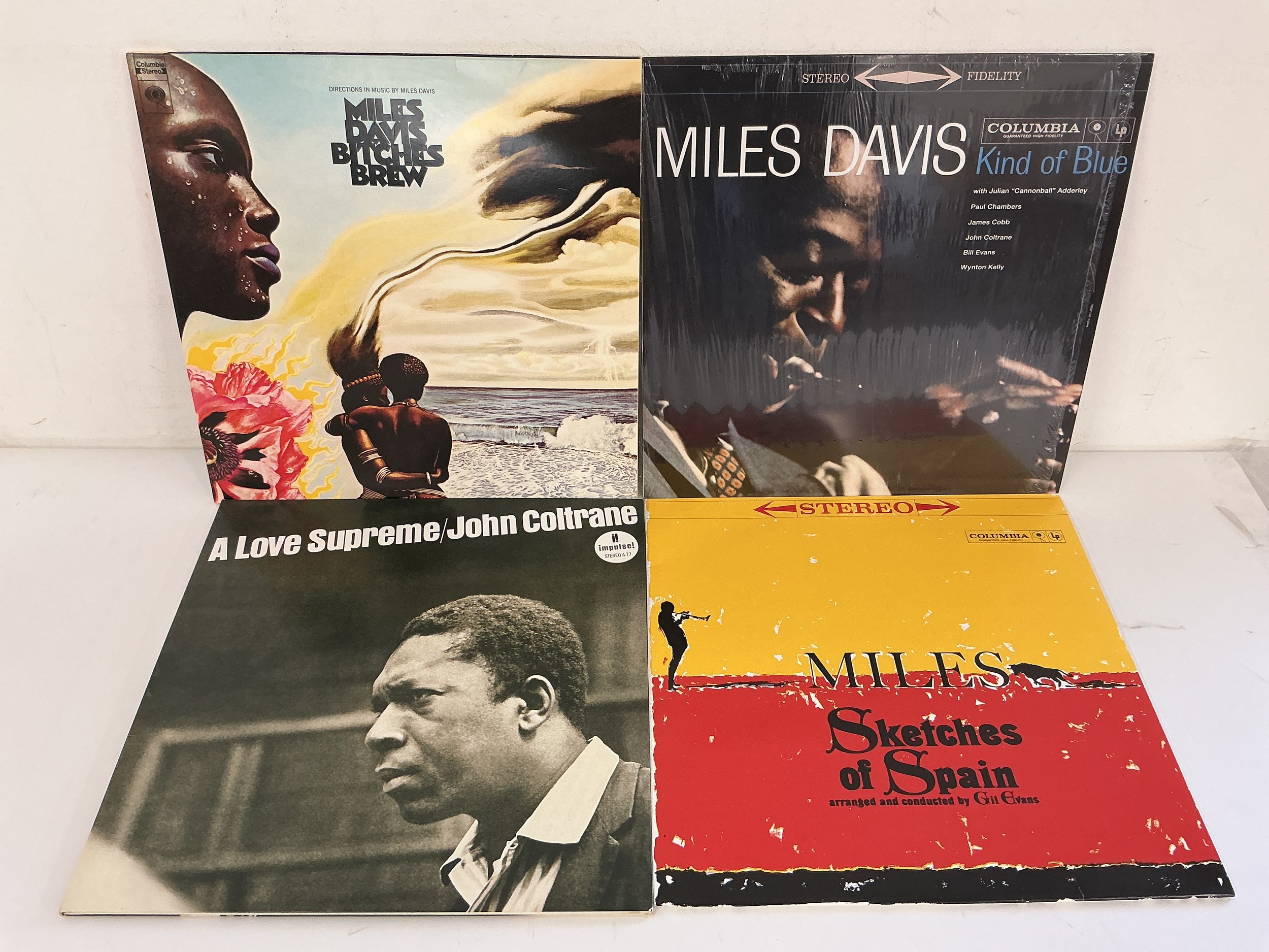 Four 180g pressings of classic jazz LPs comprising three by Miles Davis and A Love Supreme by John Coltrane. Includes coloured vinyl examples.