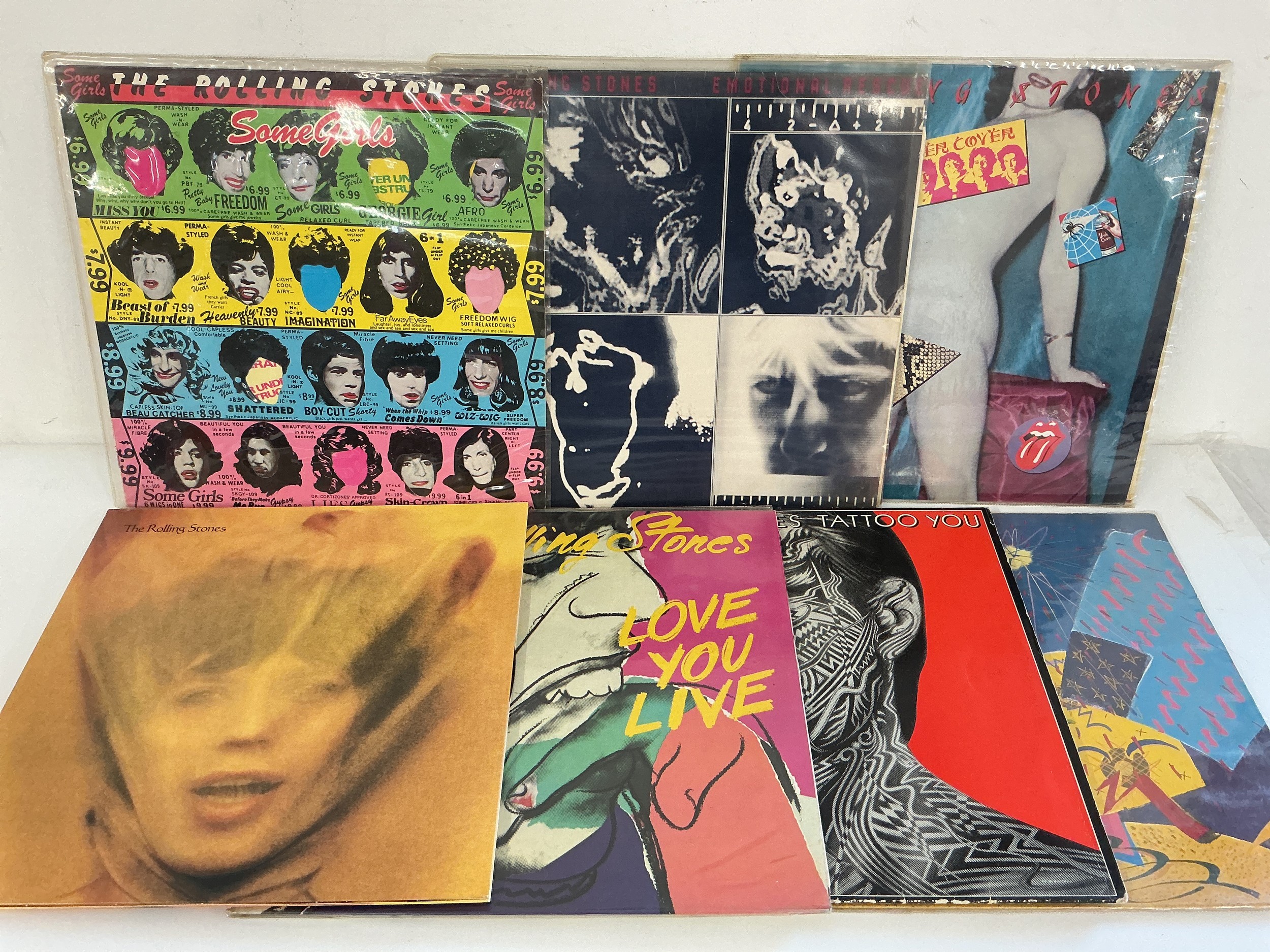 Fifteen Rolling Stones and related LPs and 12" singles comprising Goat's Head Soup, Some Girls, Emotional Rescue and others.