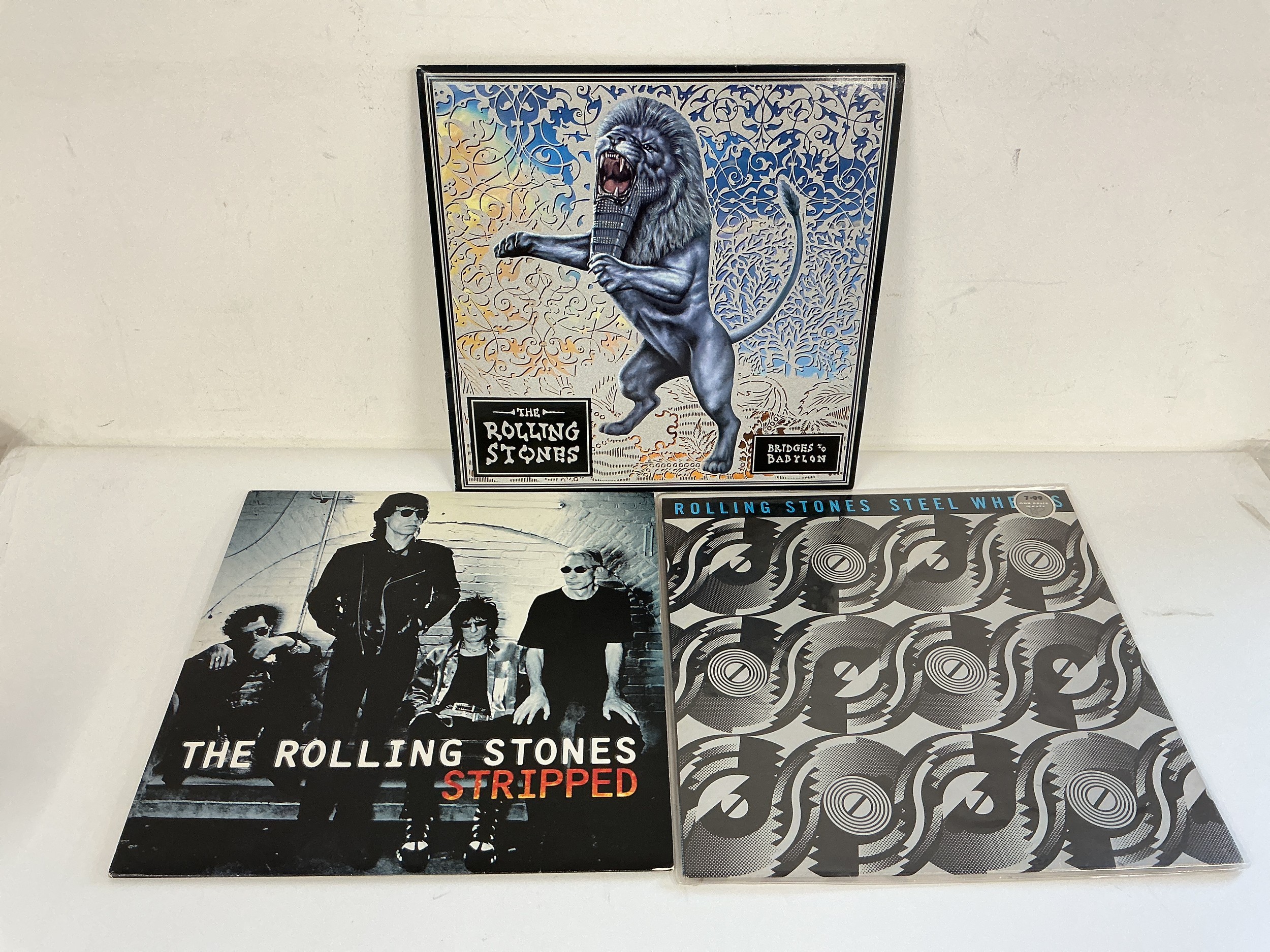 Three Rolling Stones LPs comprising Bridges To Babylon, Steel Wheels and Stripped.