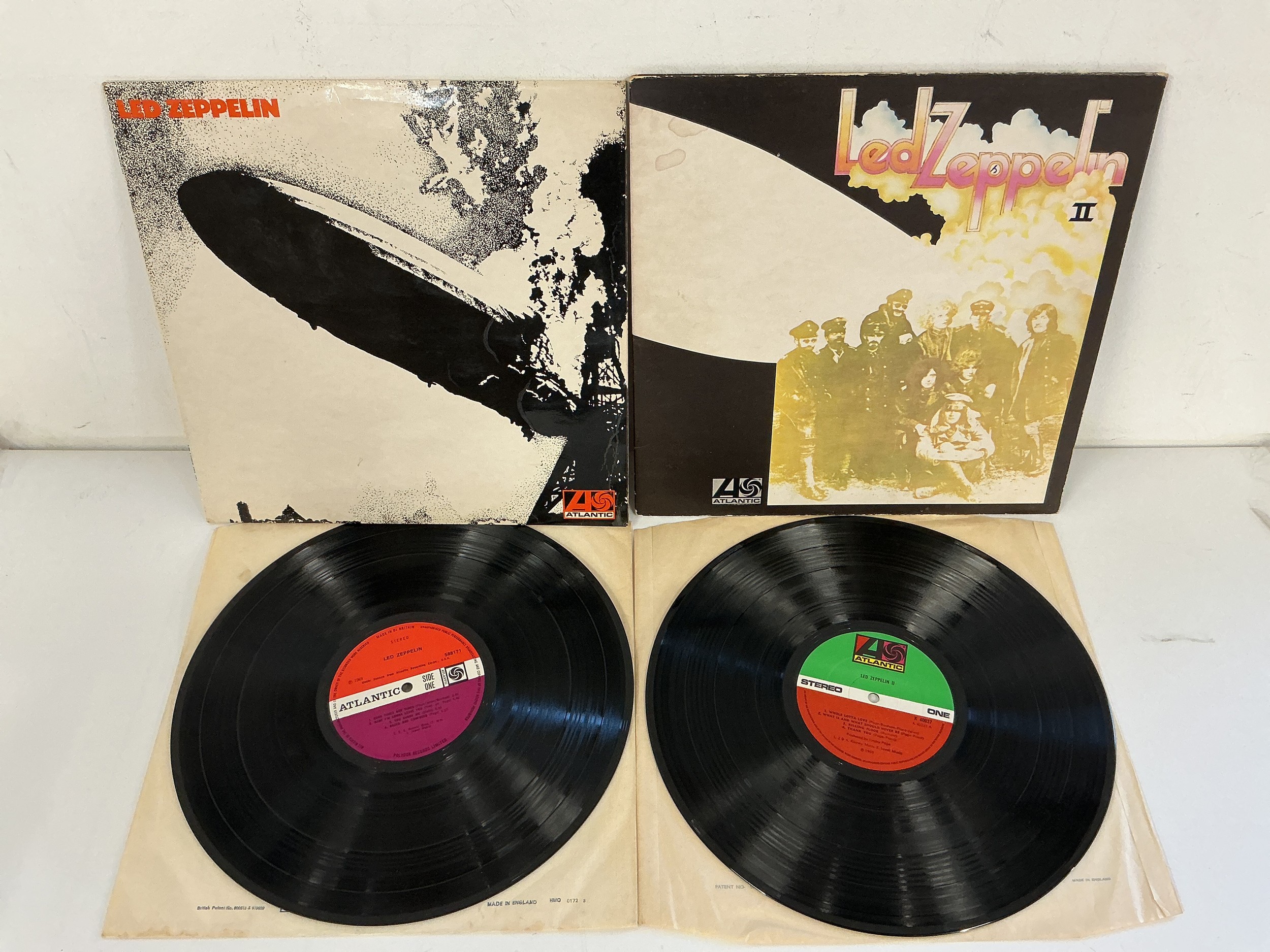 Two Led Zeppelin LPs comprising an early UK pressing of the first LP on red/plum Atlantic labels. Both records EX.
