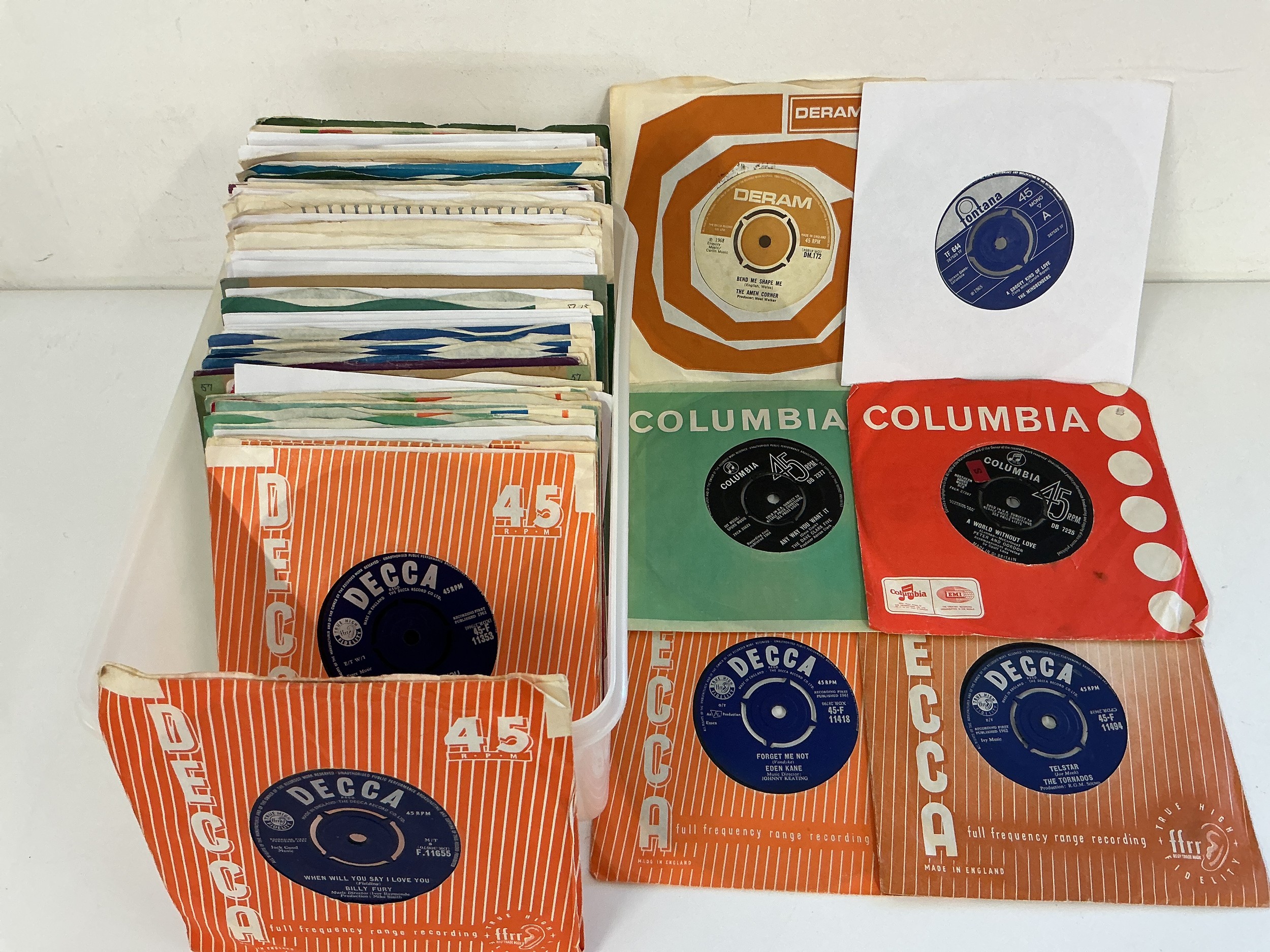 A box of 1960s 7" singles by various artists including Billy Fury, The Hollies, The Shadows and others.