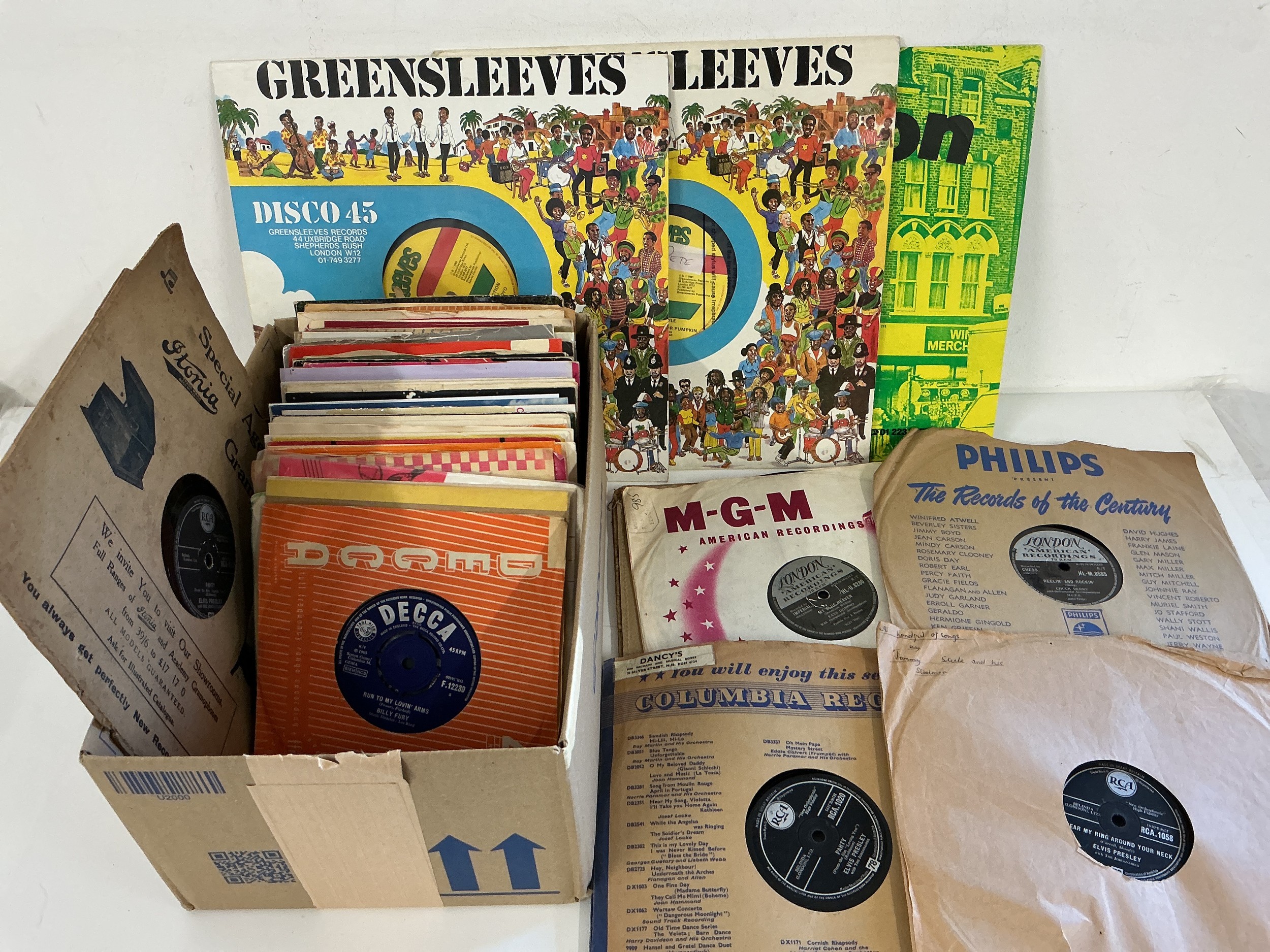 A collection of 7" singles, 78s and CDs by various artists including Elvis Presley, Billy Fury, Joy Division, The Cult and many more.