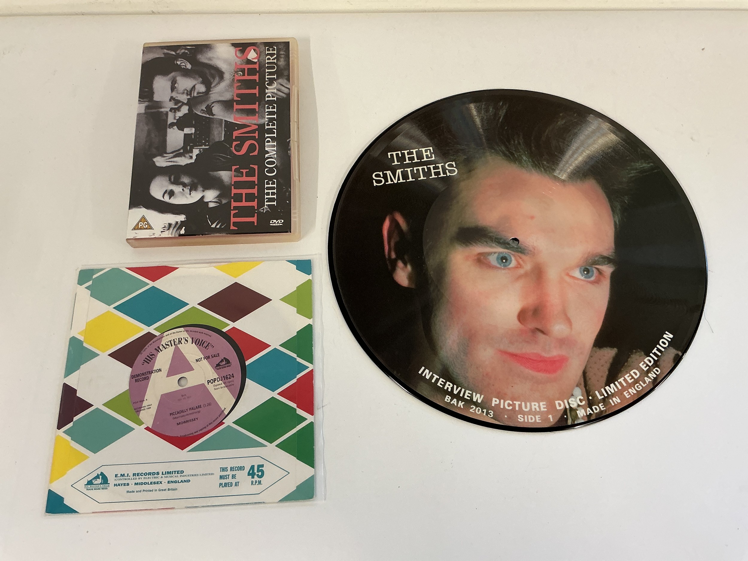 A Morrissey demo disc for Piccadilly Palare b/w Get Off The Stage together with a Smiths interview picture disc and a Smiths DVD.