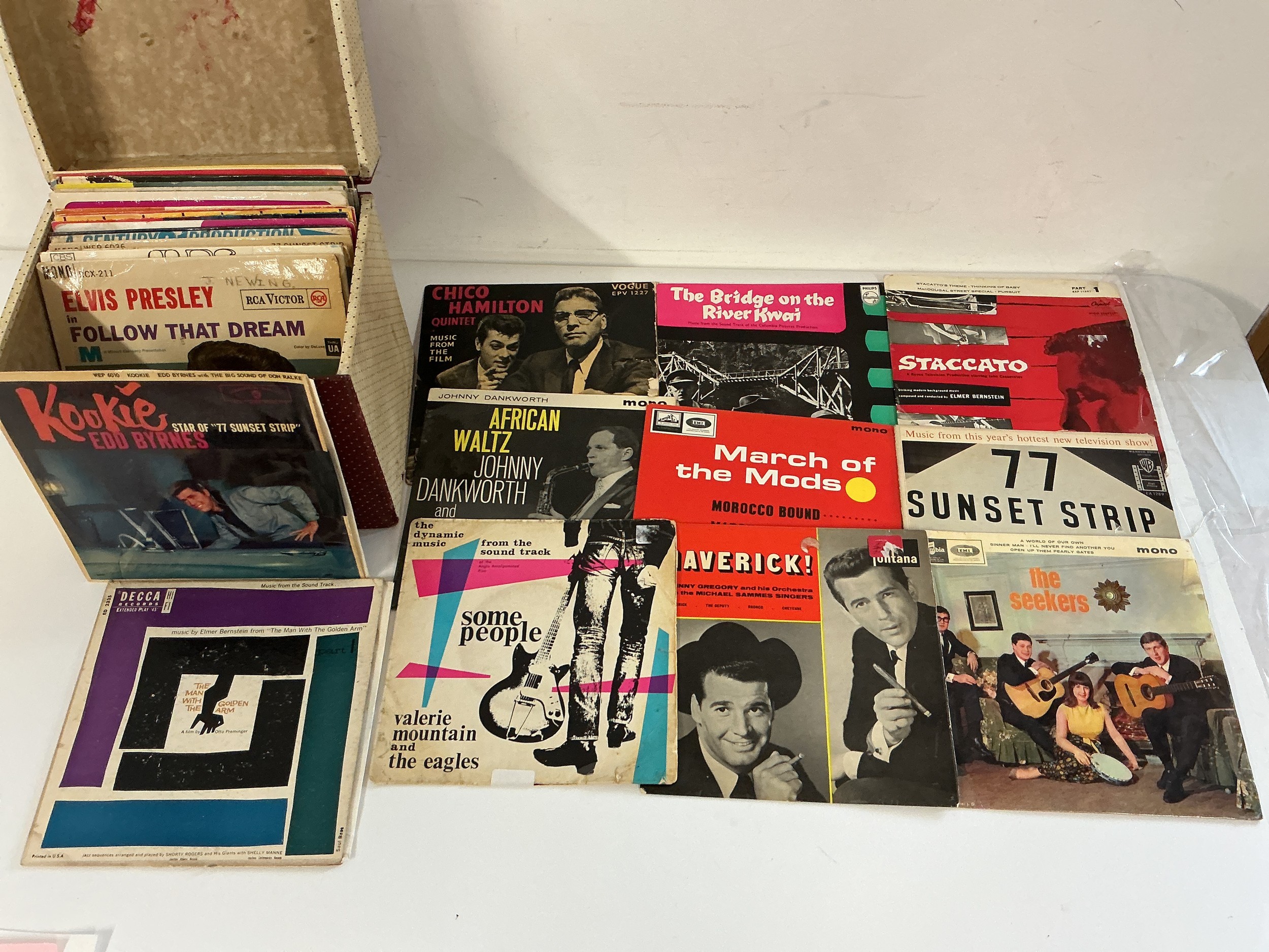 A record case of 7" singles and EPs by various artists including The Beatles, Hawkwind, Elvis Presley and others.