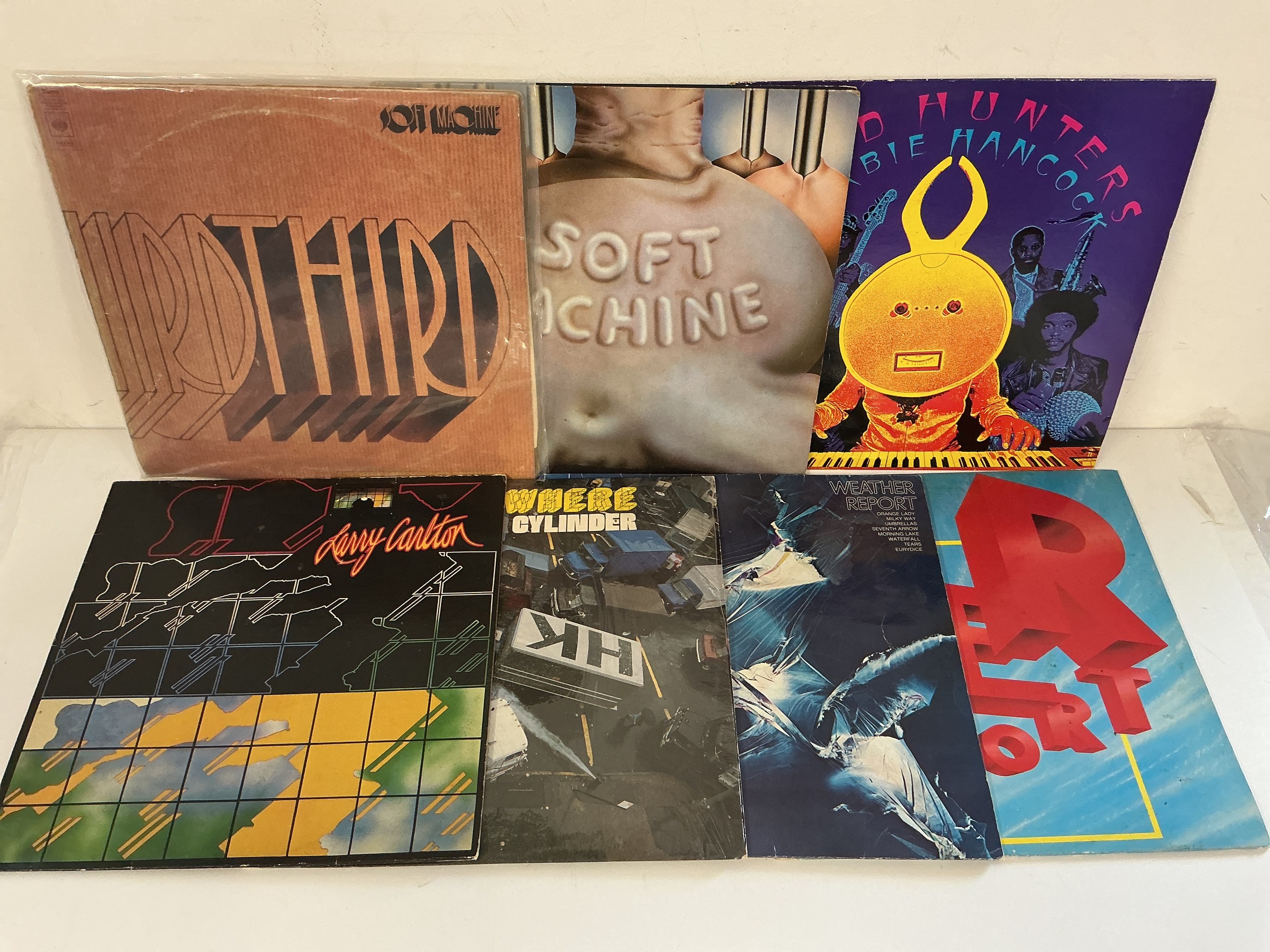 Seven jazz rock LPs by various artists including Soft Machine, Herbie Hancock, Weather Report and others.
