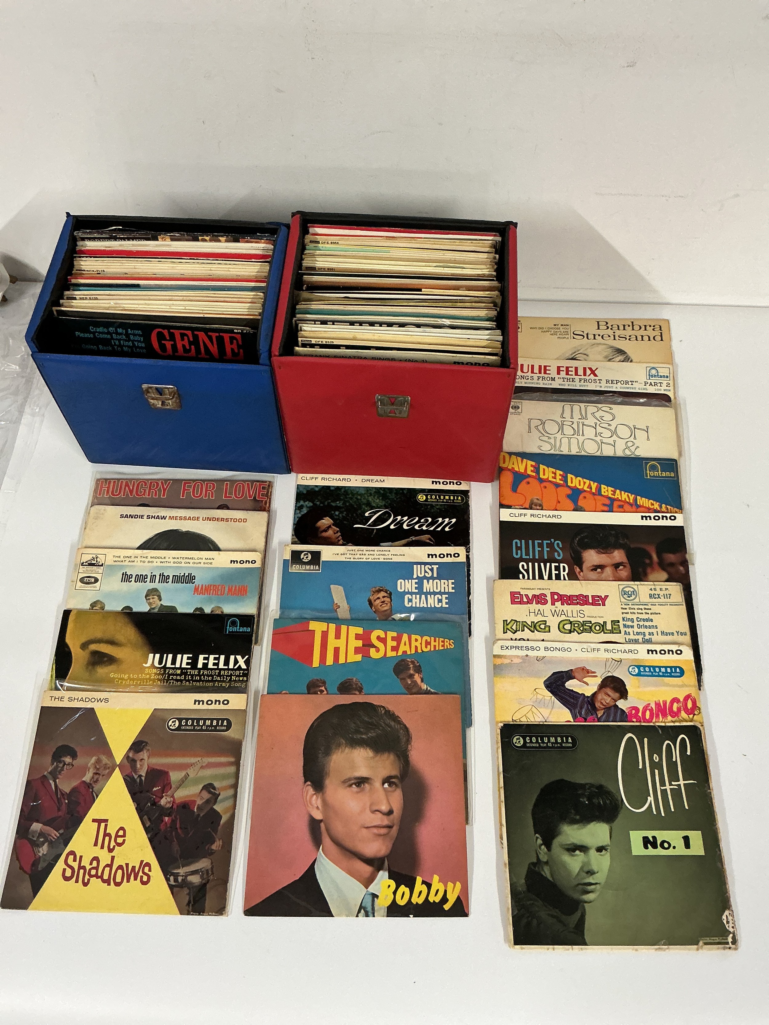 Two records cases of EPs by various artists including Elvis Presley, Cliff Richard, Bobby Rydell and many more.