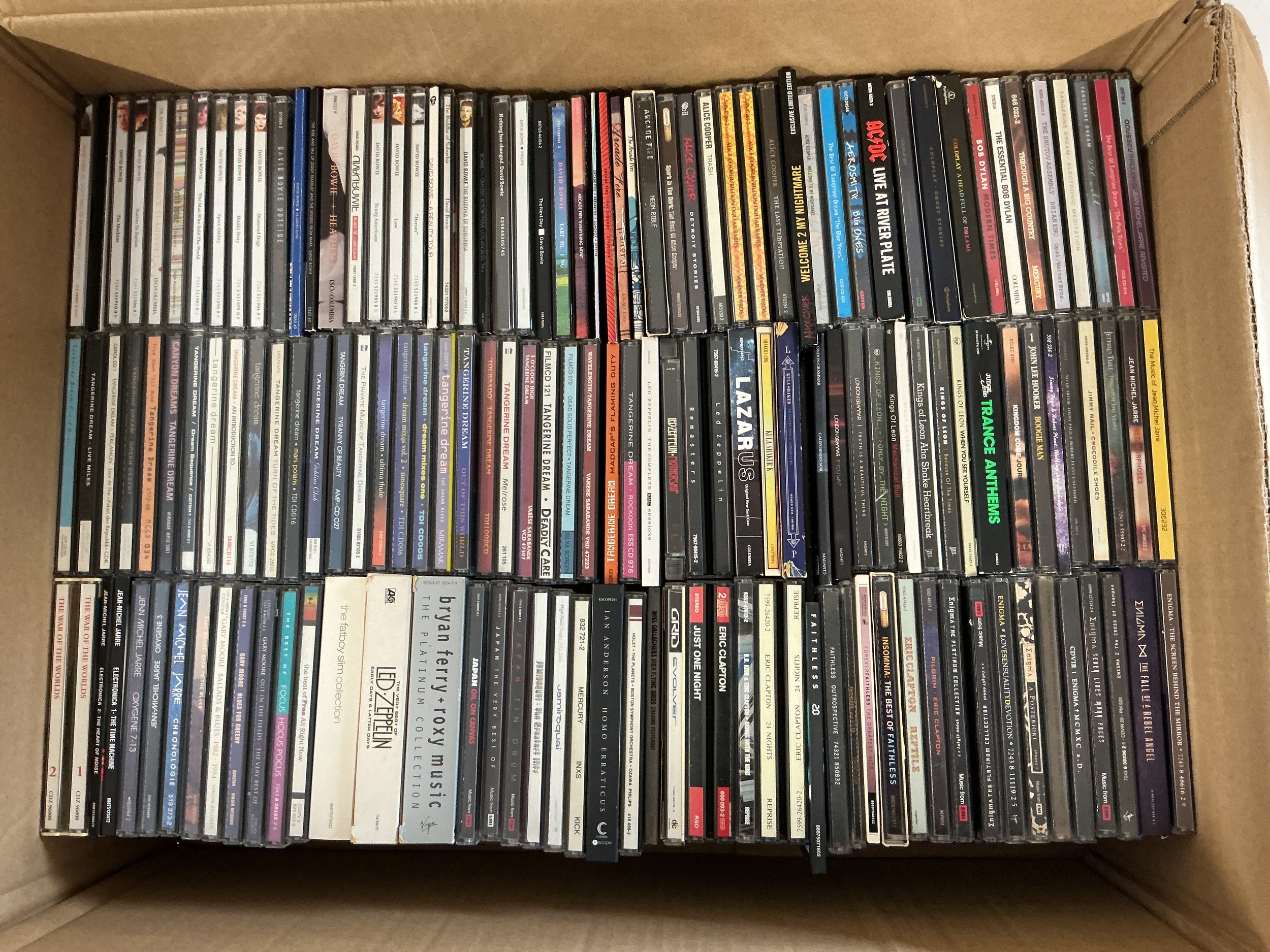 Three boxes of CDs by various artists including AC/DC, Coldplay, Enigma, Tangerine Dream and many more.