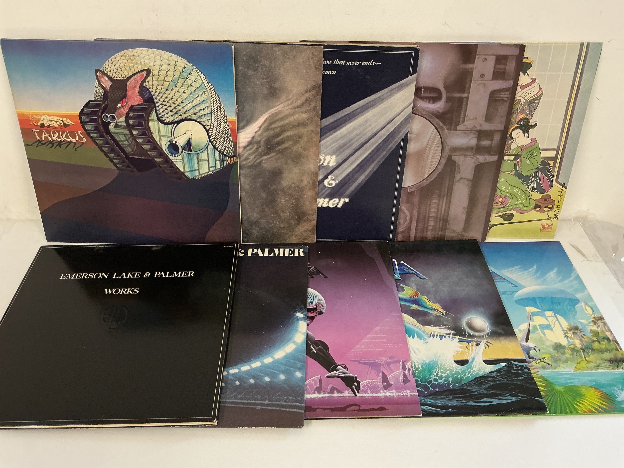 Ten LPs by Emerson, Lake & Palmer and Asia comprising Tarkus, Astra, Brain Salad Surgery and others.