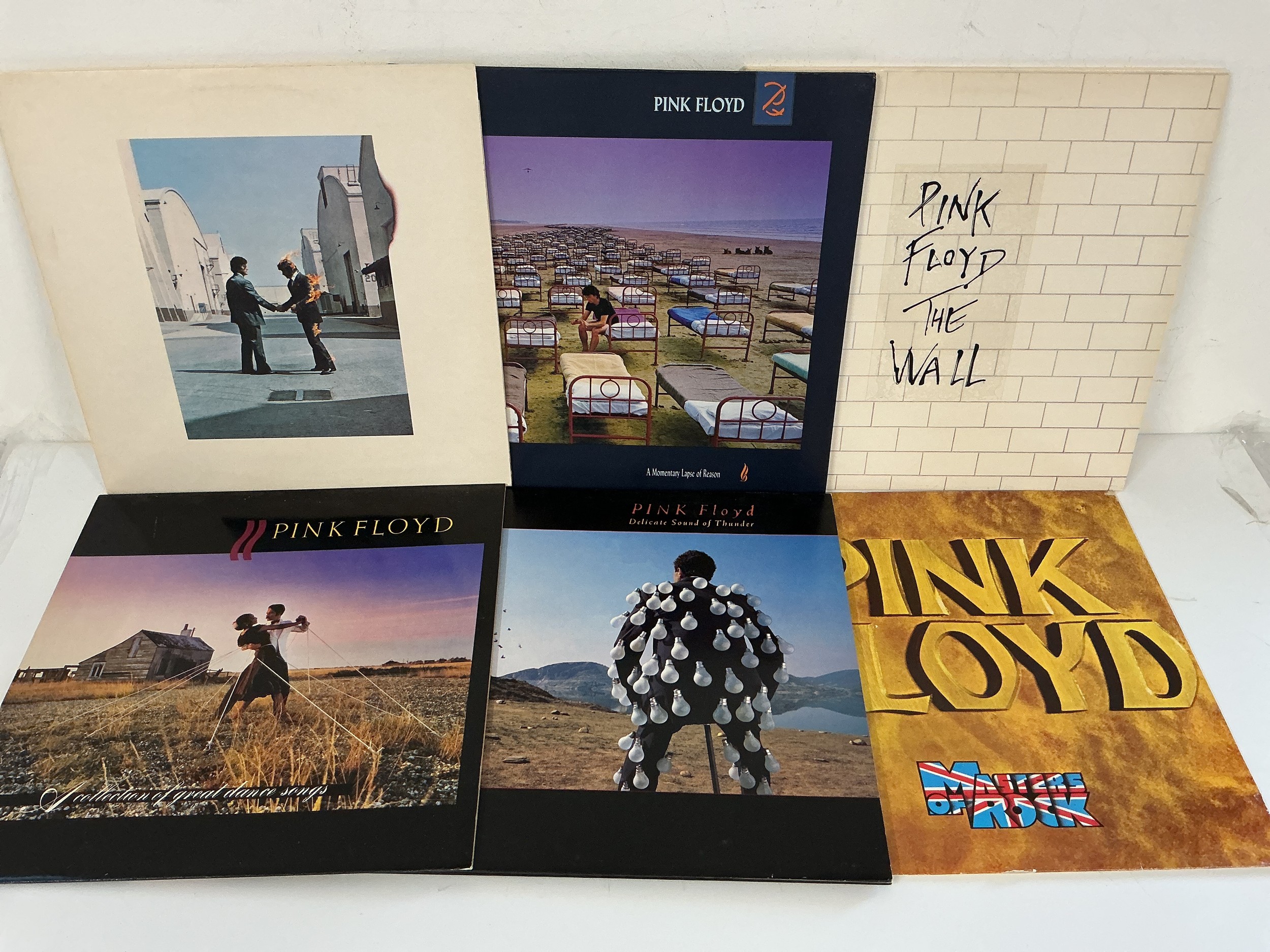Six Pink Floyd LPs comprising The Wall, A Momentary Lapse Of Reason, Wish You Were Here and others.