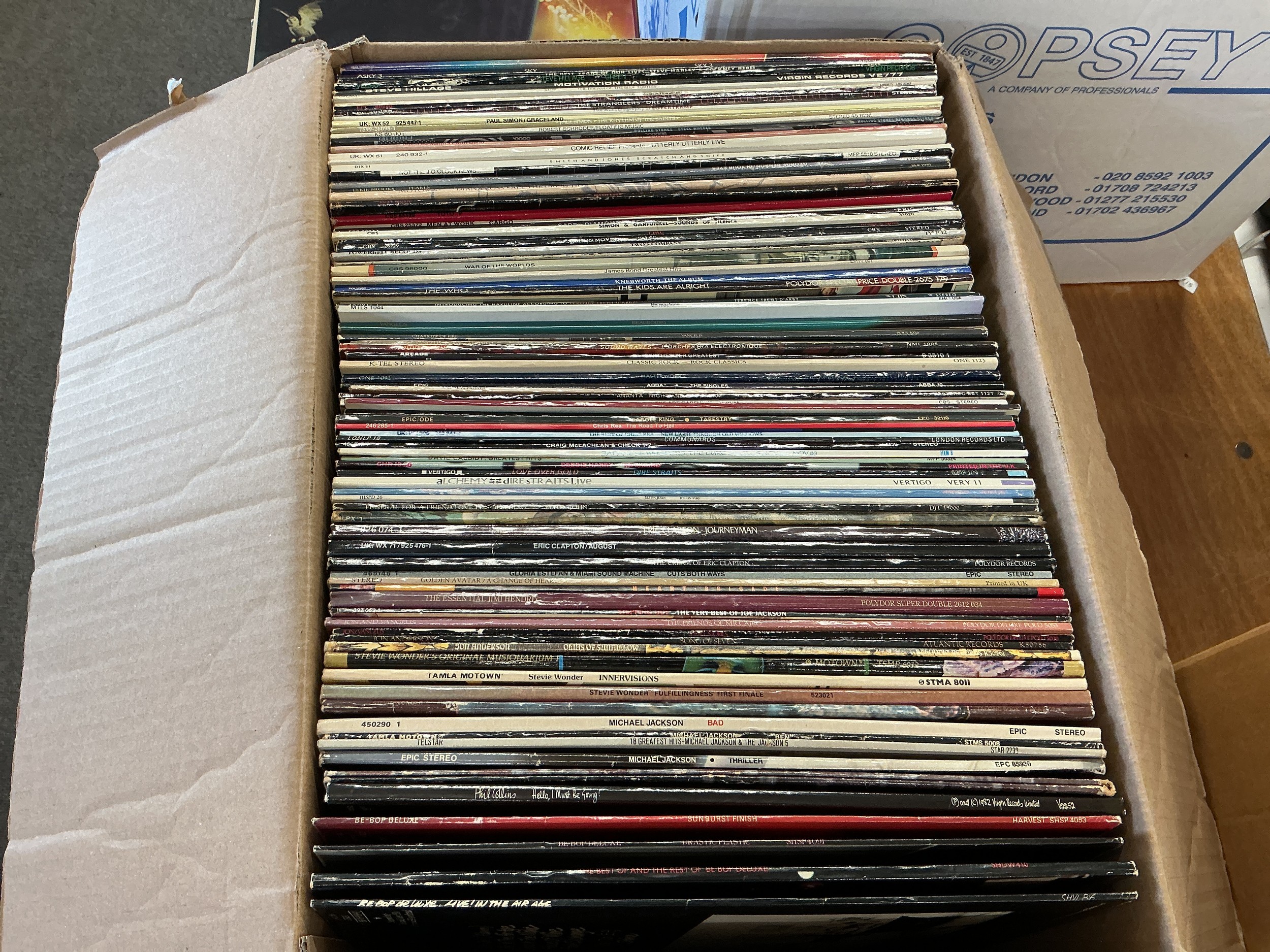 A collection of LPs by various artists including The Who, Jimi Hendrix, The Stranglers and others.