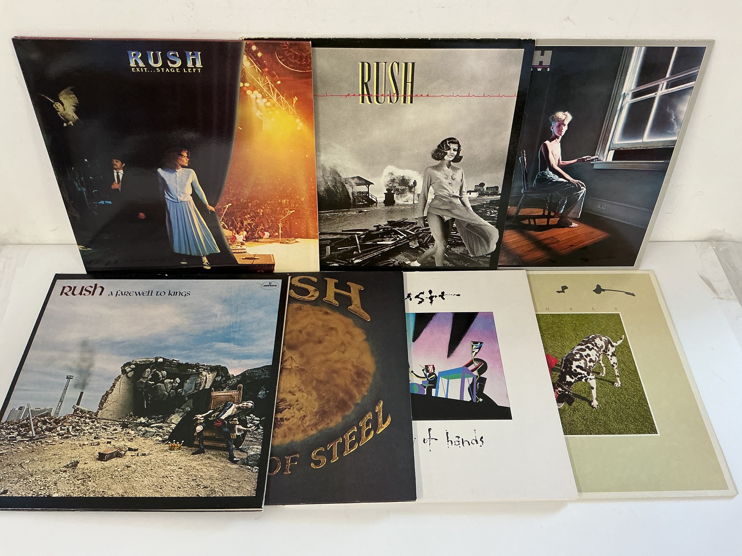 Fourteen LPs by Rush comprising A Farewell To Kings, Hemispheres, Permanent Waves and others.