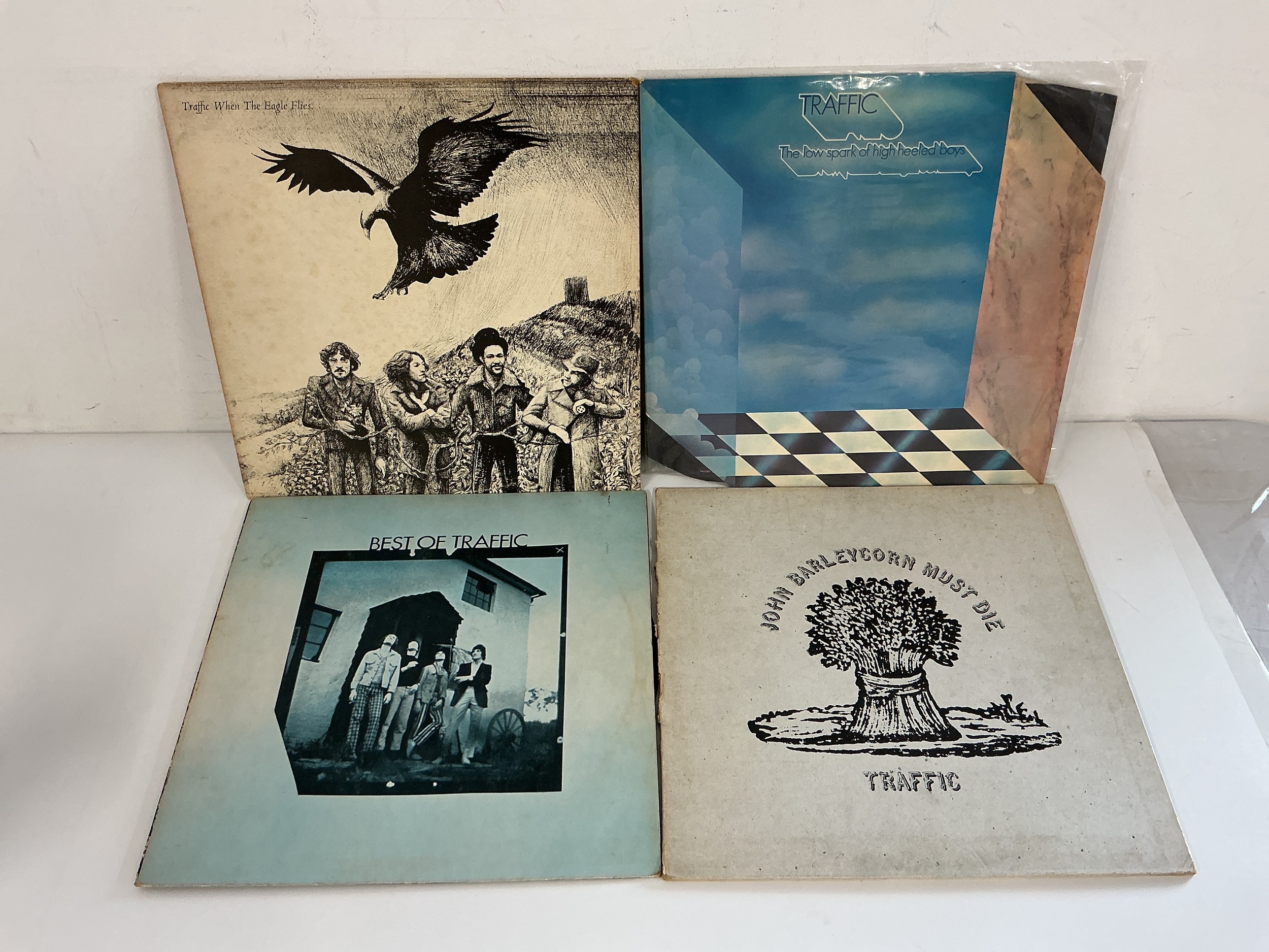Four LPs by Traffic comprising John Barleycorn Must Die, When The Eagle Flies, The Low Spark Of High Heeled Boys and The Best Of Traffic.