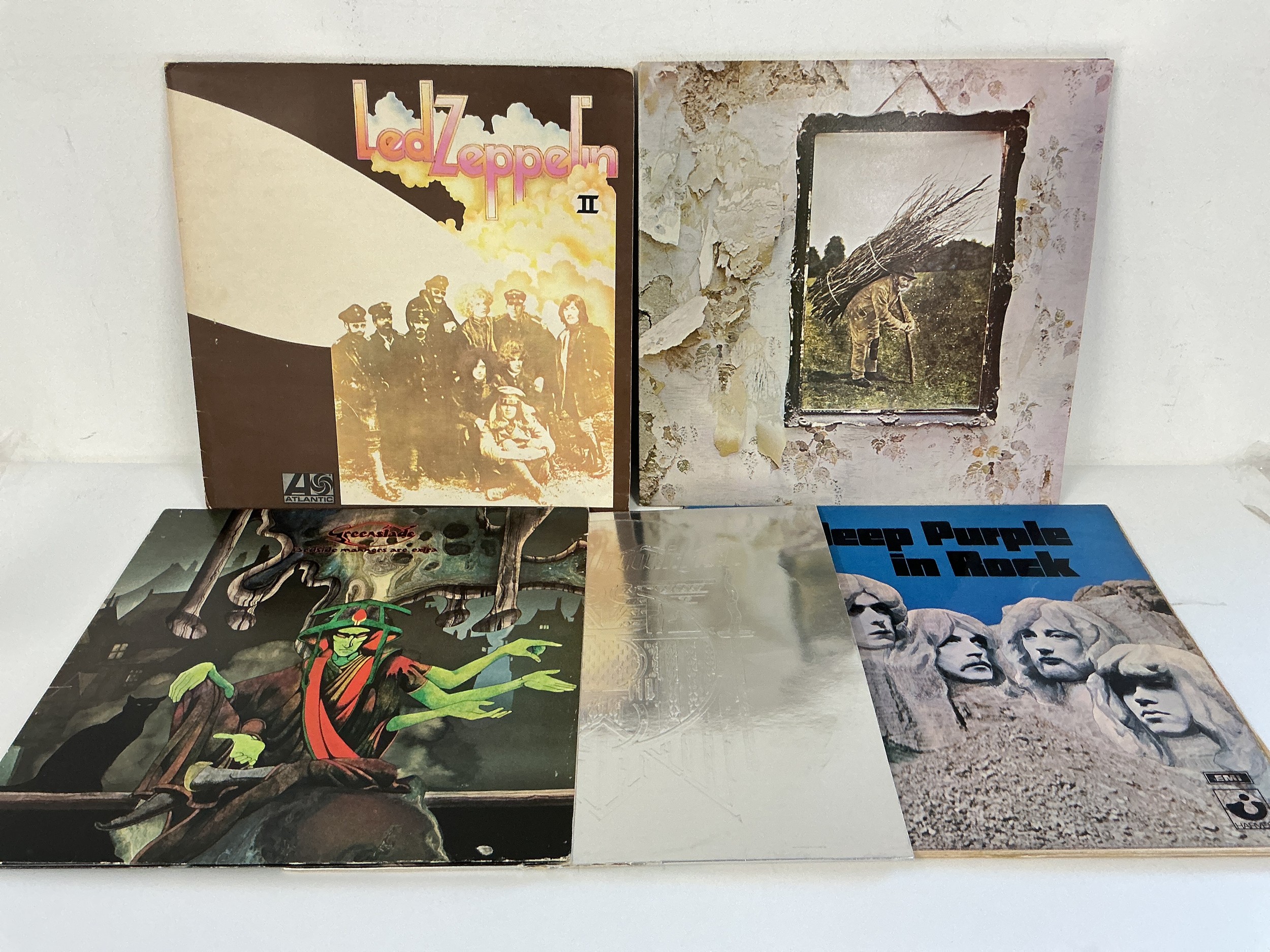 Four rock LPs and a 12" single comprising Led Zeppelin II with red/plum Atlantic labels, Led Zeppelin IV, In Rock by Deep Purple, Bedside Manners Are Extra by Greenslade and a Silver Machine 12" single by Hawkwind.