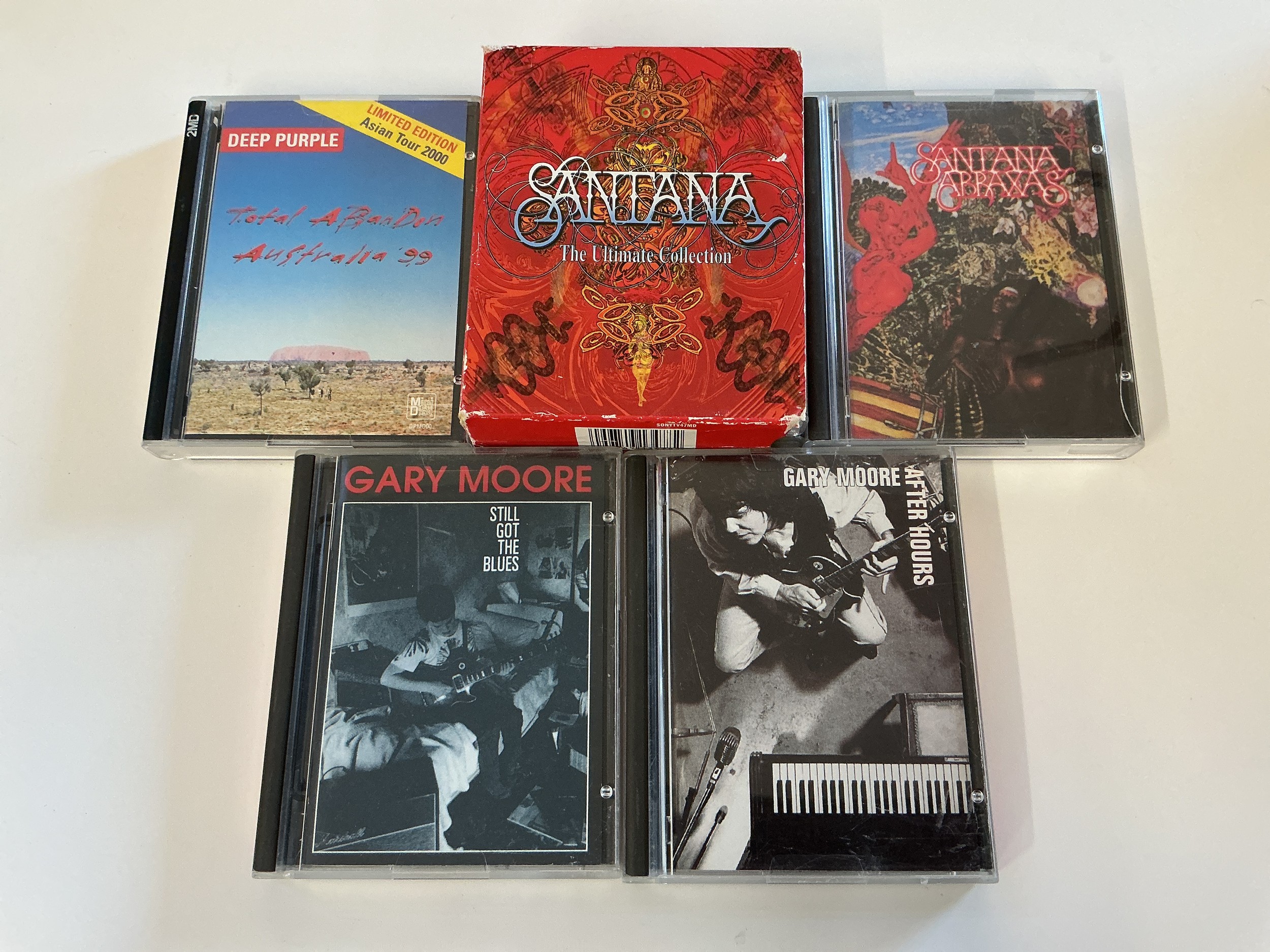 Five minidiscs by various artists comprising Santana, Gary Moore and Deep Purple.