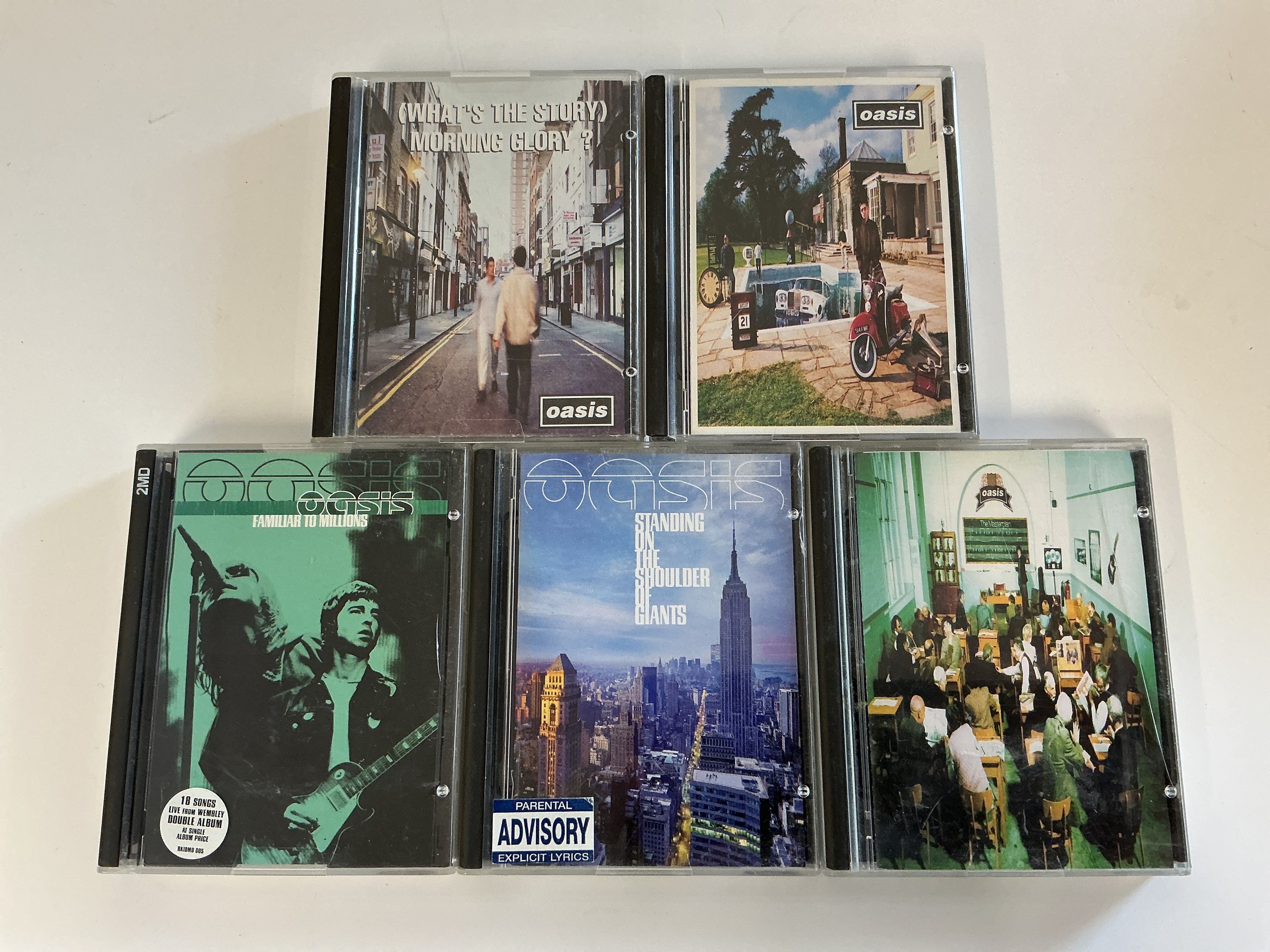 Five Oasis minidiscs comprising What's The Story Morning Glory?, Be Here Now, Familiar To Millions and others.