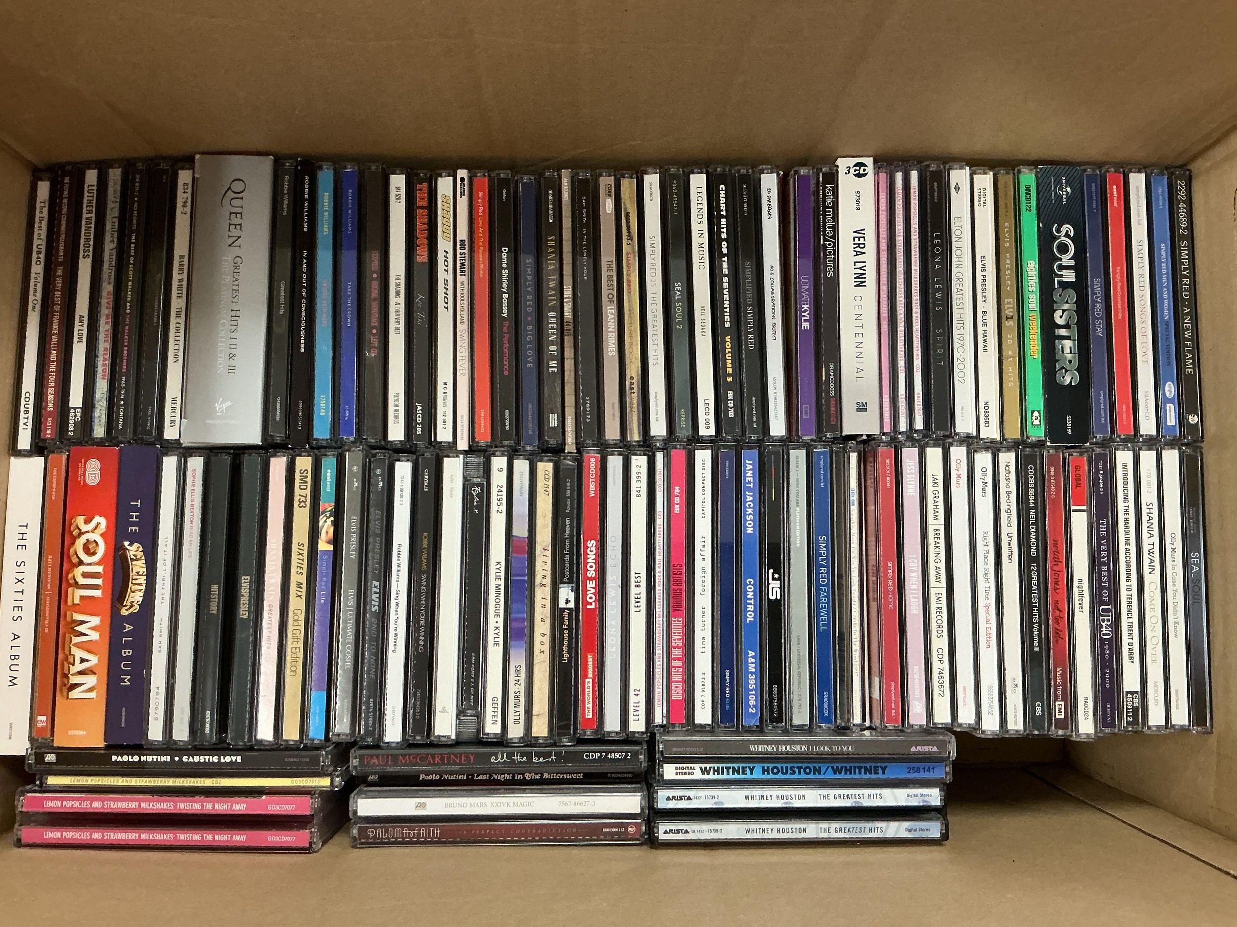 Two boxes of CDs by various artists including The Beatles, Ed Sheeran, Adele, Olly Murs and many more.