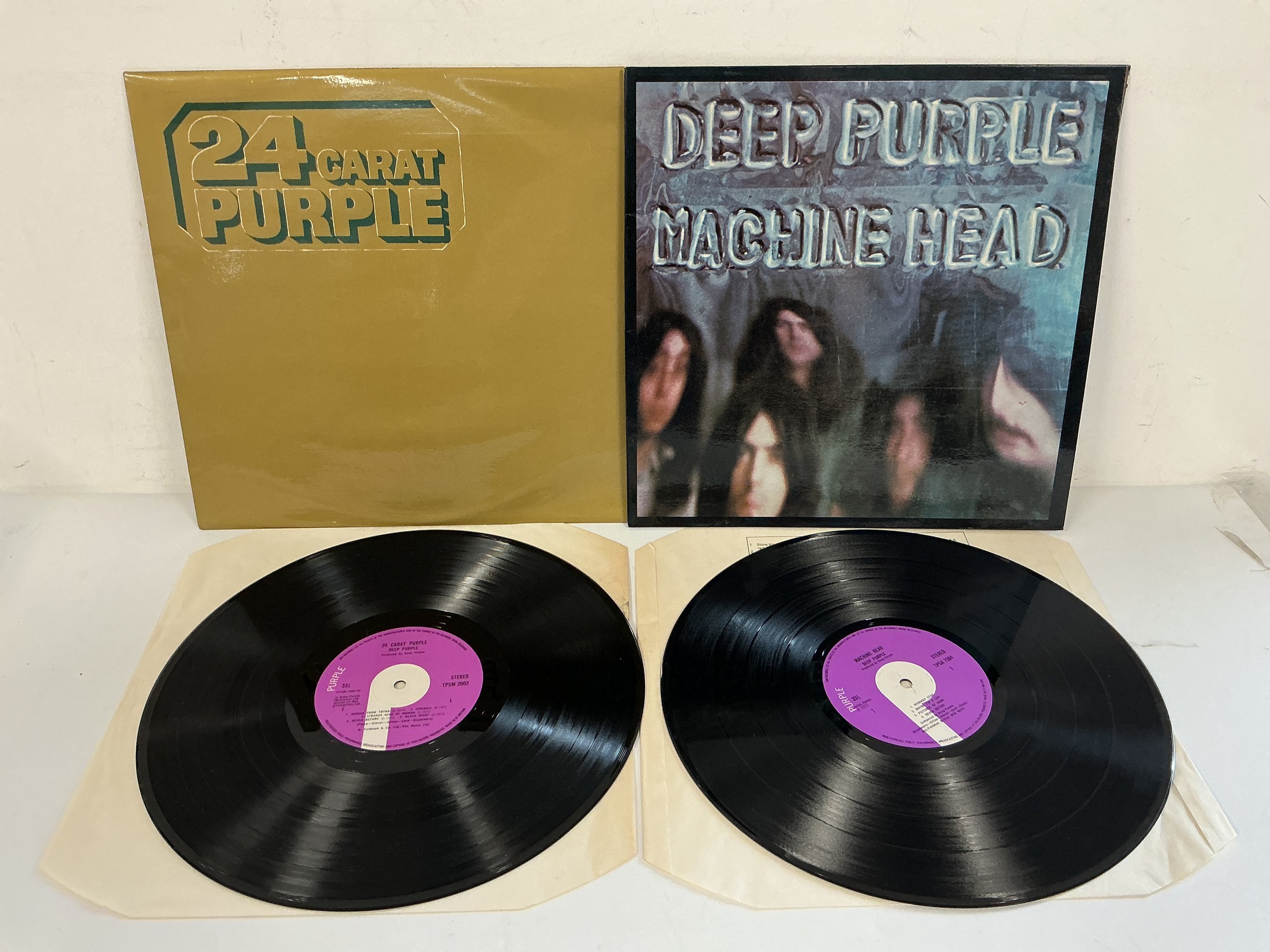 Two Deep Purple LPs comprising a first UK pressing of Machine Head with poster insert and 24 Carat Purple.