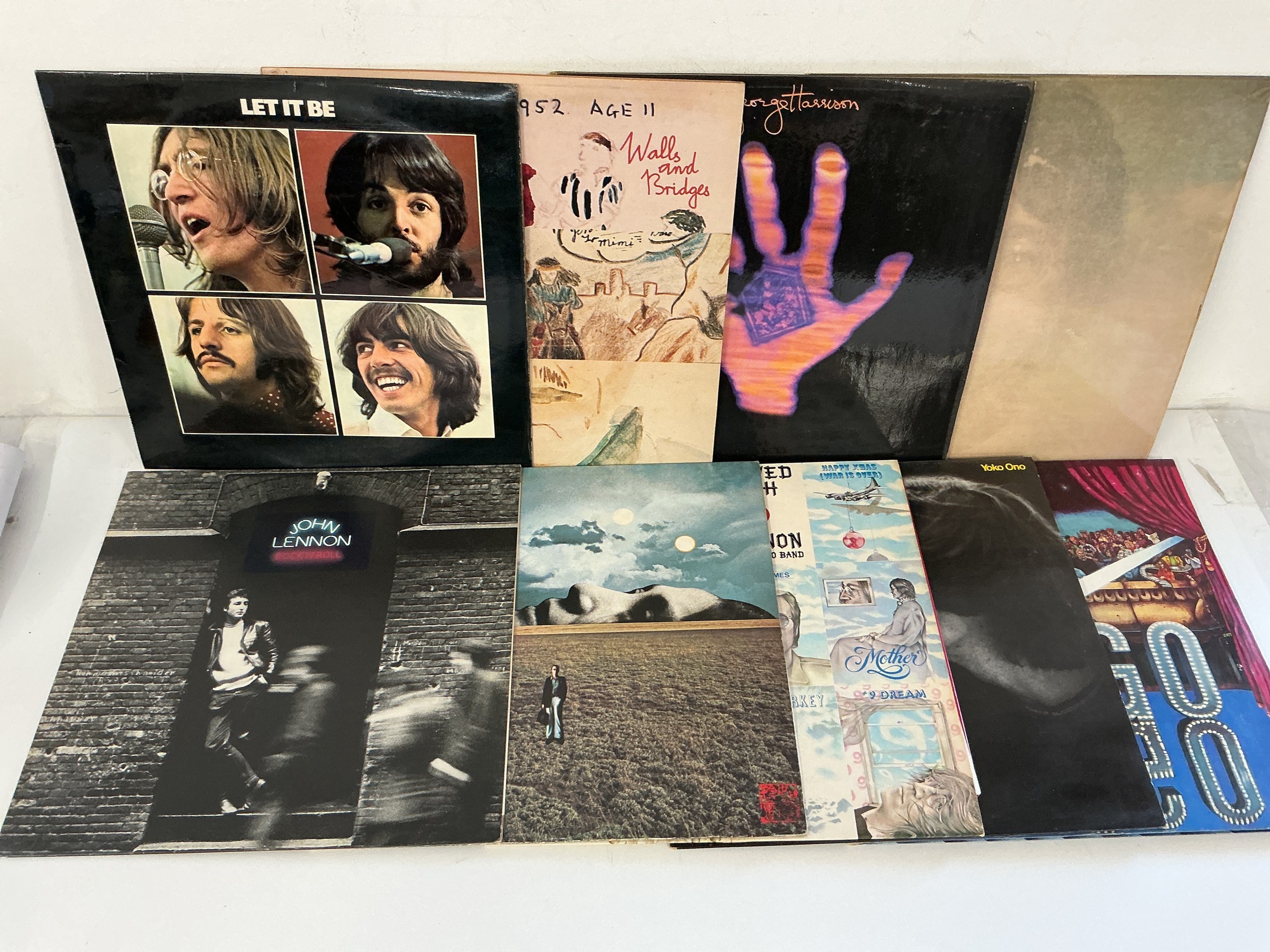 Nine Beatles and solo LPs comprising Let It Be, Walls & Bridges, Mind Games and others.