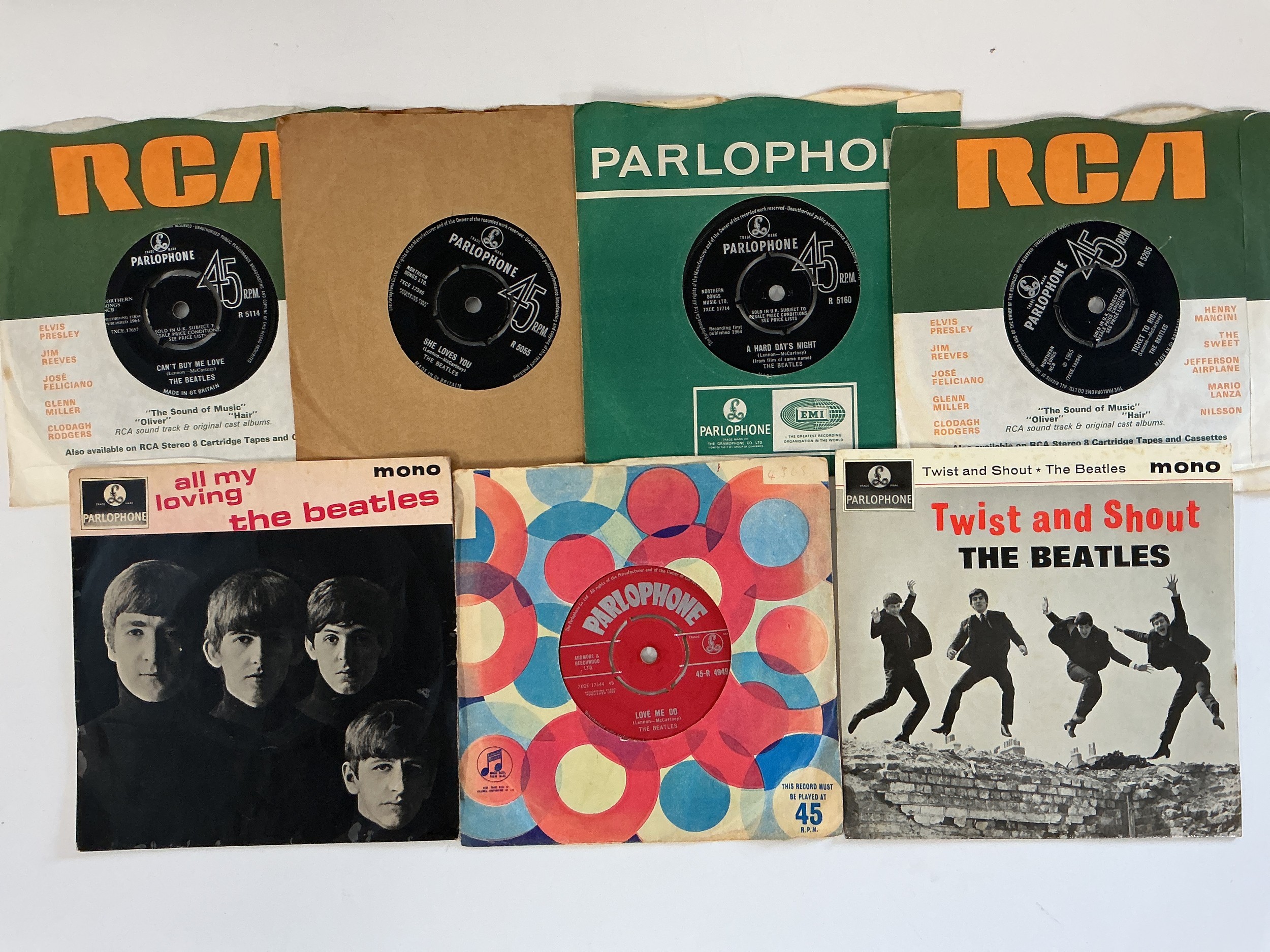 A collection of Beatles 7" singles and EPs including a red label Love Me Do with ZT tax code, All My Loving EP, She Loves You and others.