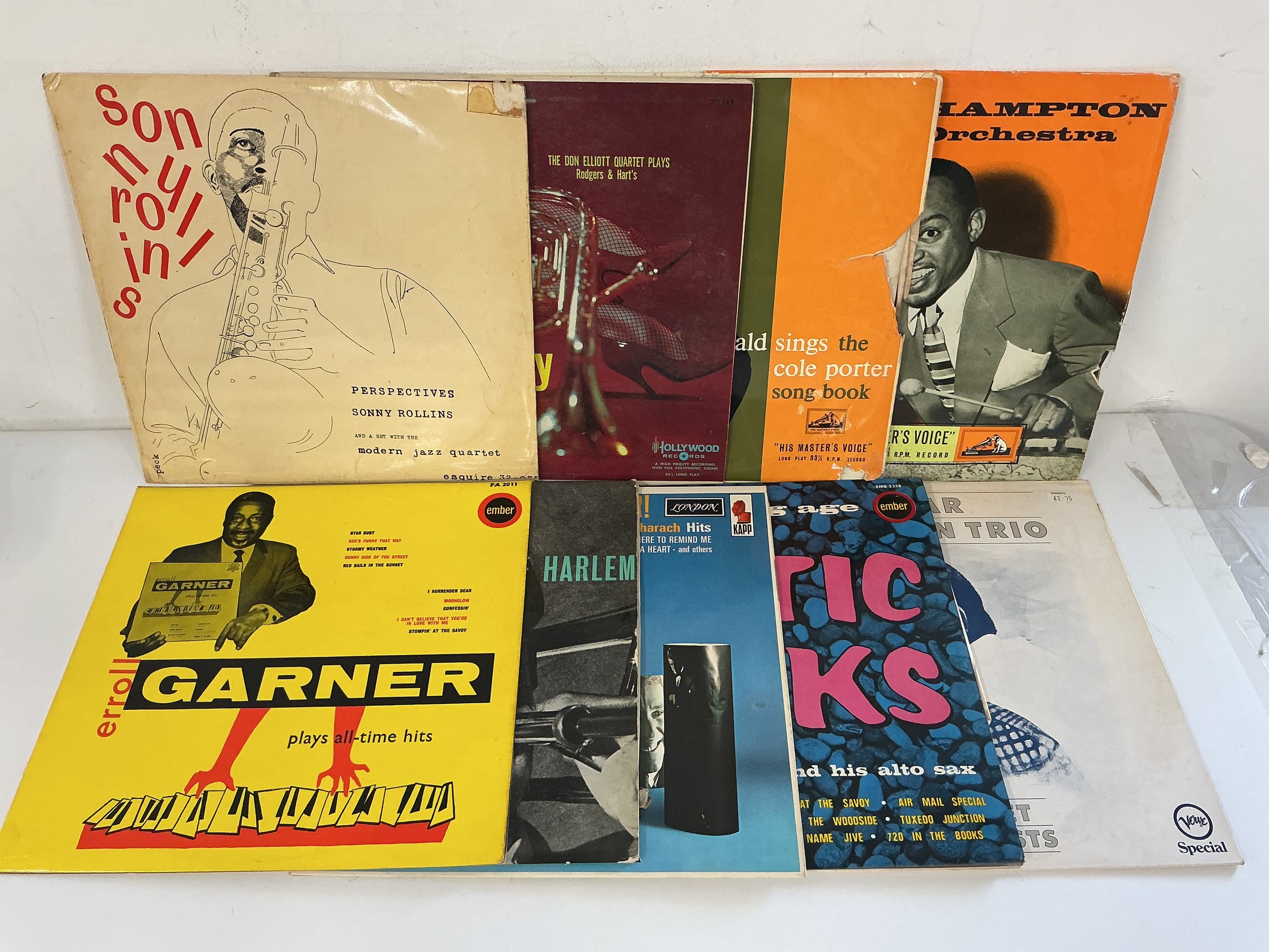 A collection of mainly jazz LPs and 10" records by various artists including Sonny Rollins, Oscar Peterson, George Lewis and others.