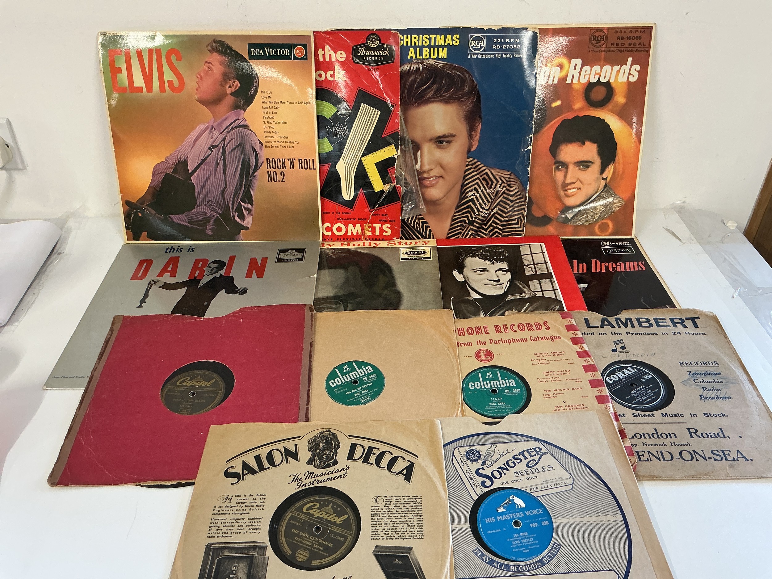 A collection of mainly rock n roll LPs and 78s by various artists including Rock n Roll No2 by Elvis Presley, Gene Vincent, Buddy Holly and others.